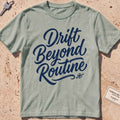 bay heavyweight tee with brush-script "Drift Beyond Routine" typography.
