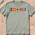 bay heavyweight tee with maritime signal flags spelling out the word "DRIFT."