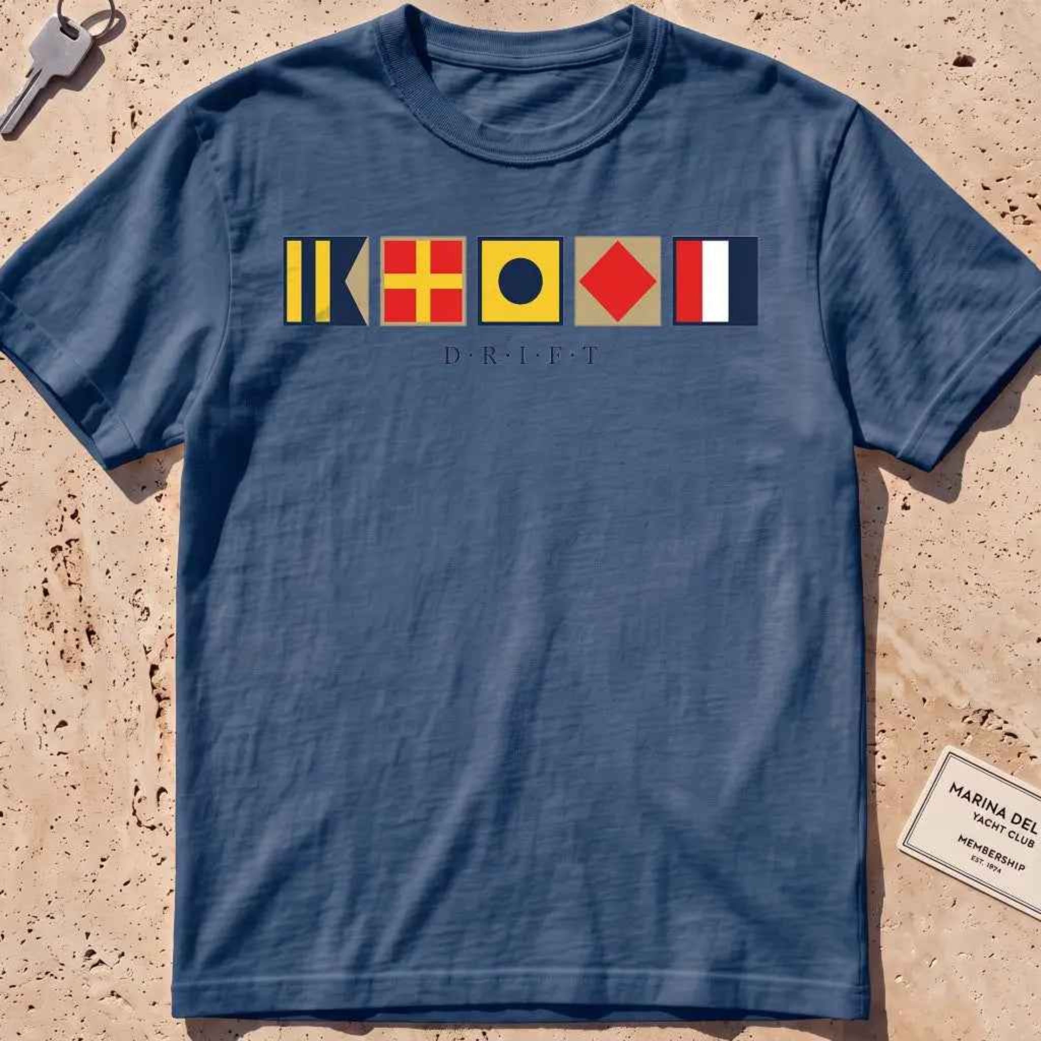 midnight heavyweight tee with maritime signal flags spelling out the word "DRIFT."