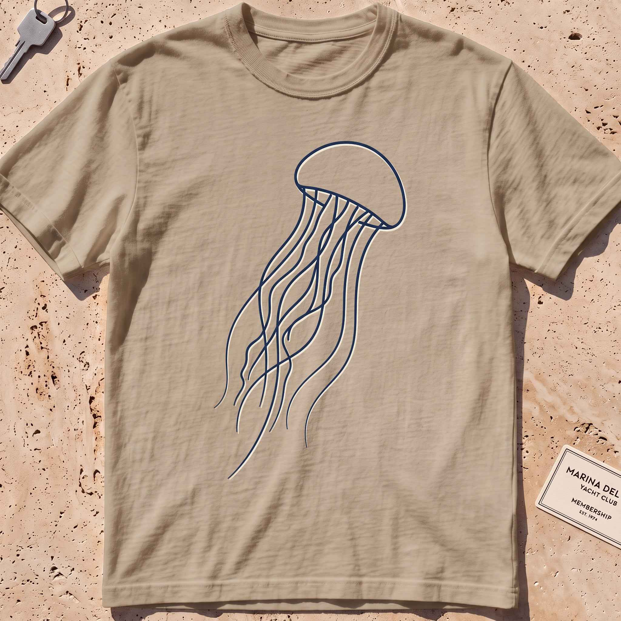 khaki heavyweight tee with a single-line drifting jellyfish graphic.