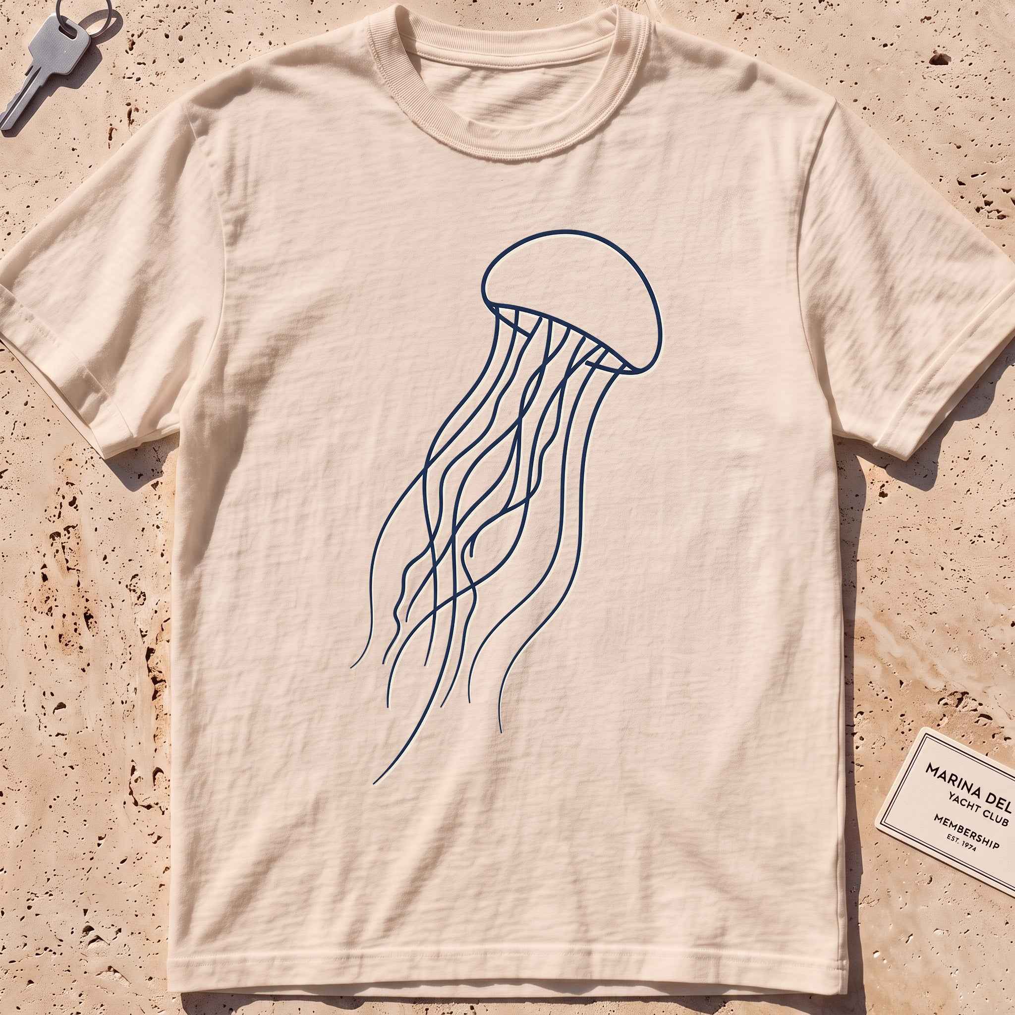 ivory heavyweight tee with a single-line drifting jellyfish graphic.