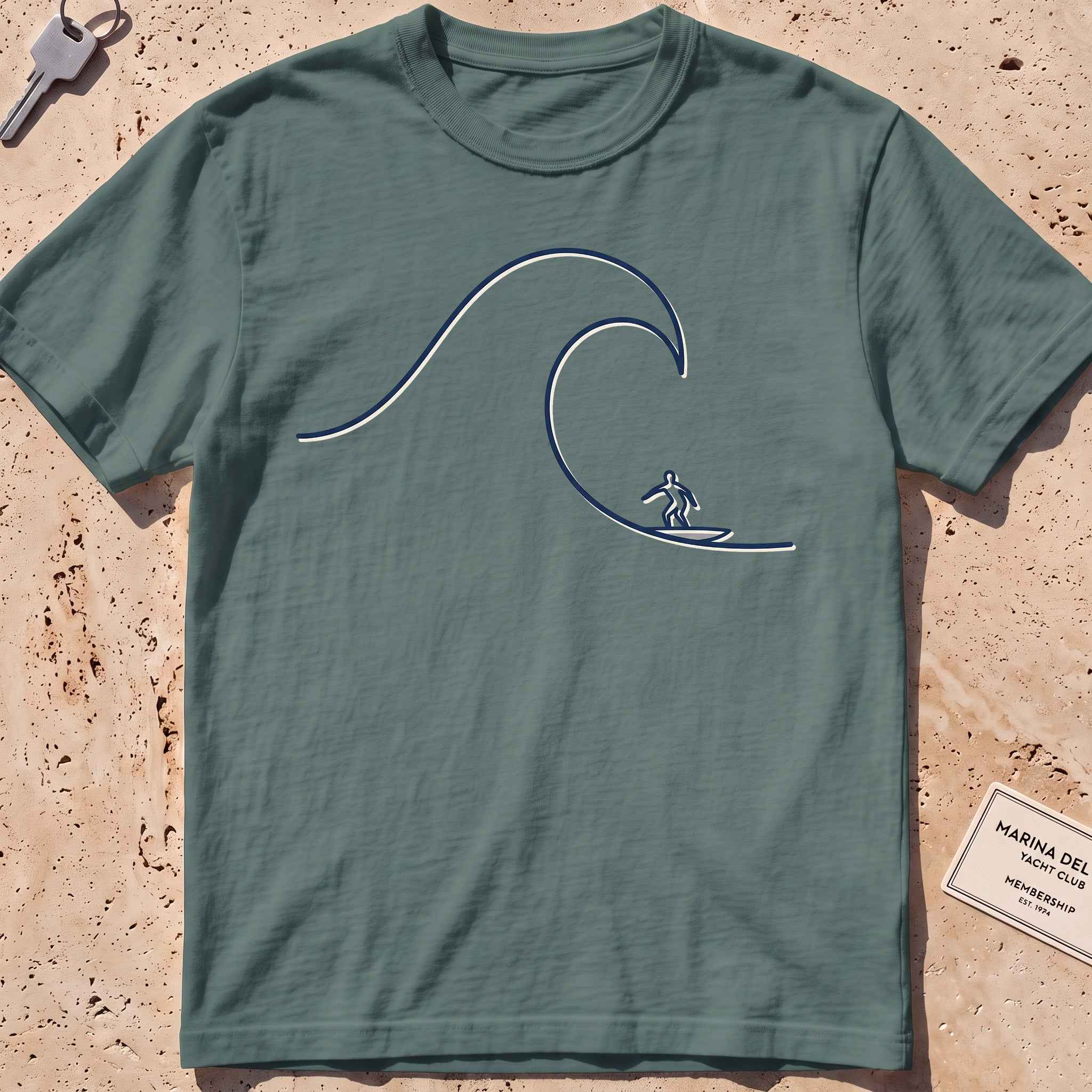 blue spruce heavyweight tee with a single-line surfer dropping into a wave graphic.