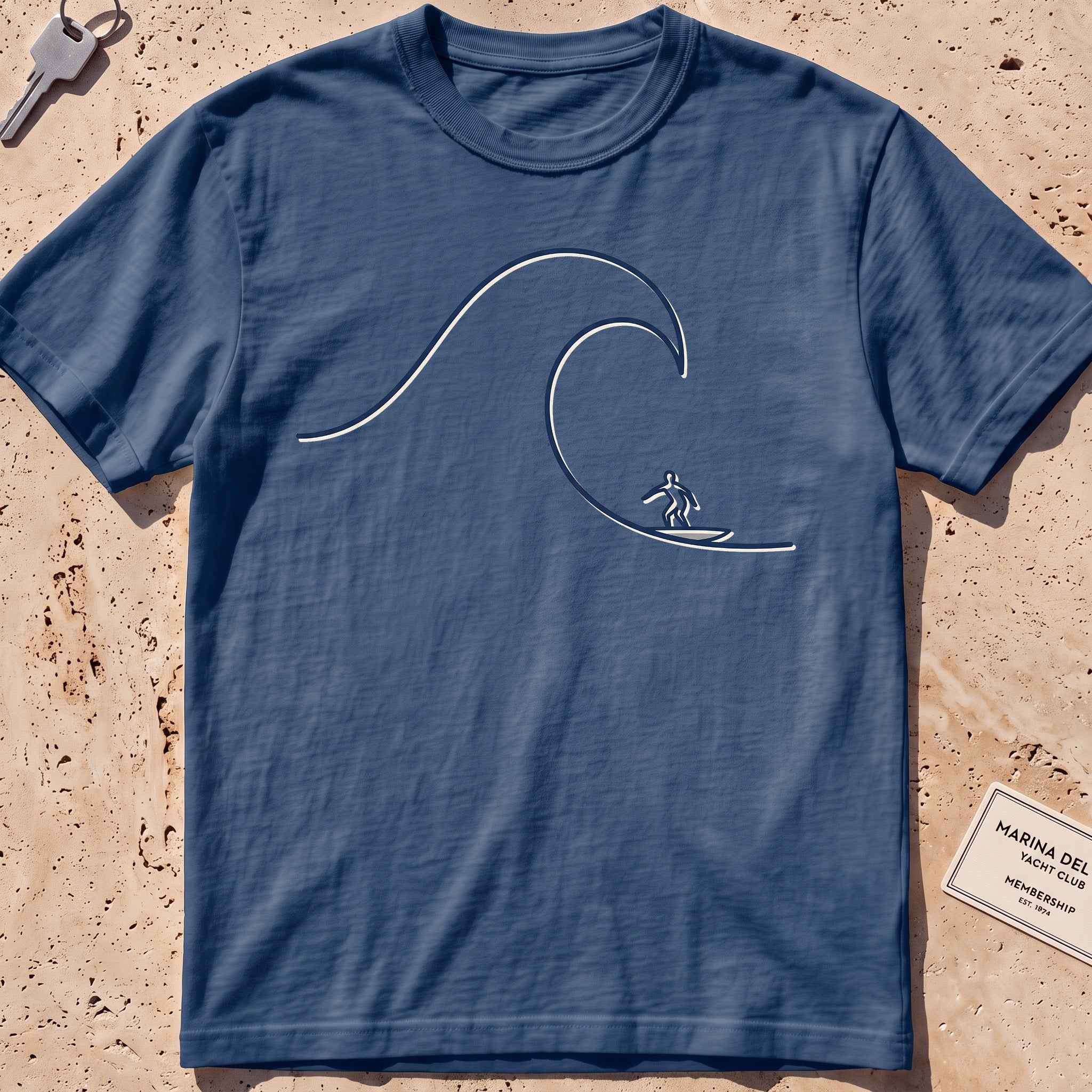 midnight heavyweight tee with a single-line surfer dropping into a wave graphic.