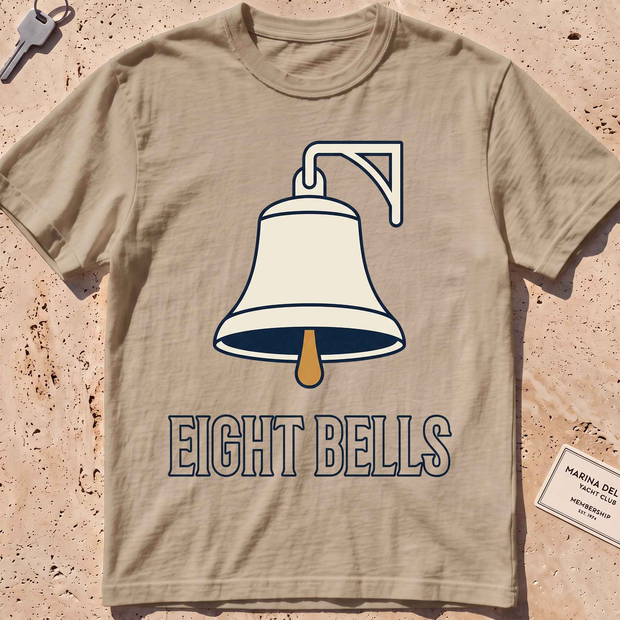 khaki heavyweight tee with a bold ship's-bell "Eight Bells" graphic.