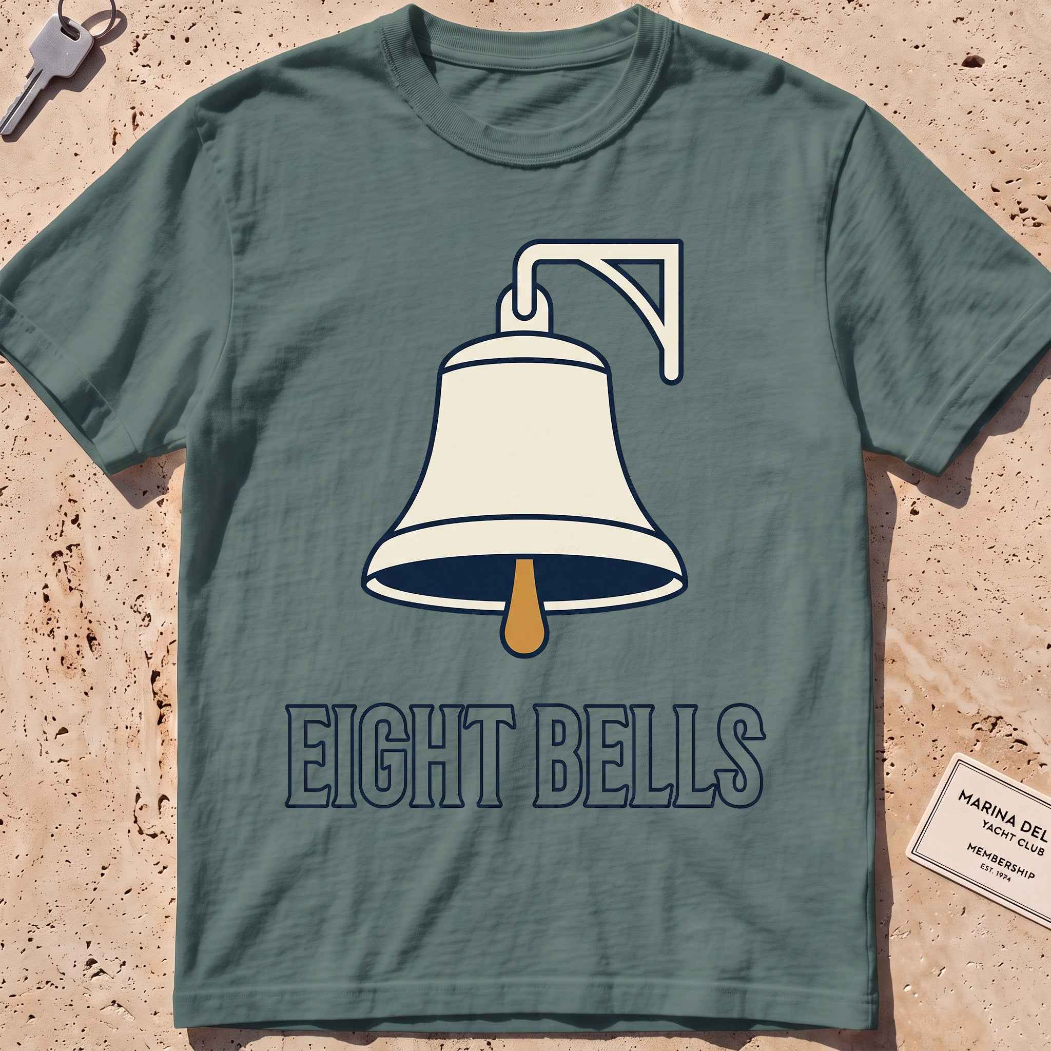 blue spruce heavyweight tee with a bold ship's-bell "Eight Bells" graphic.