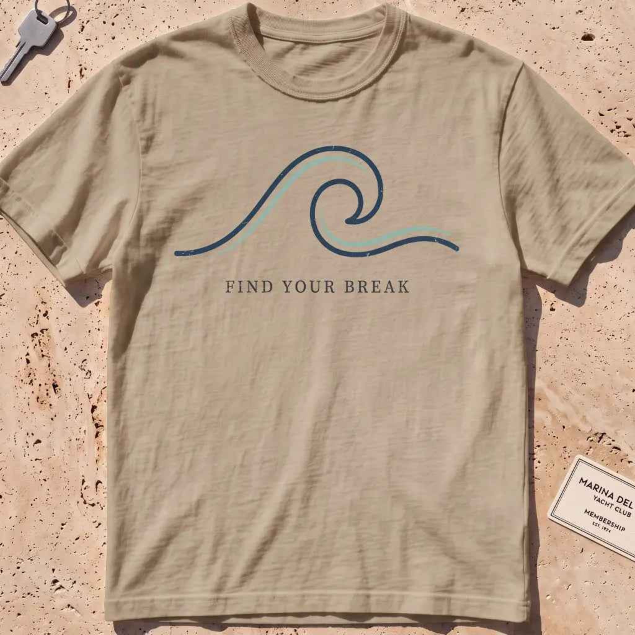 khaki heavyweight tee with a single-line wave "Find Your Break" graphic.