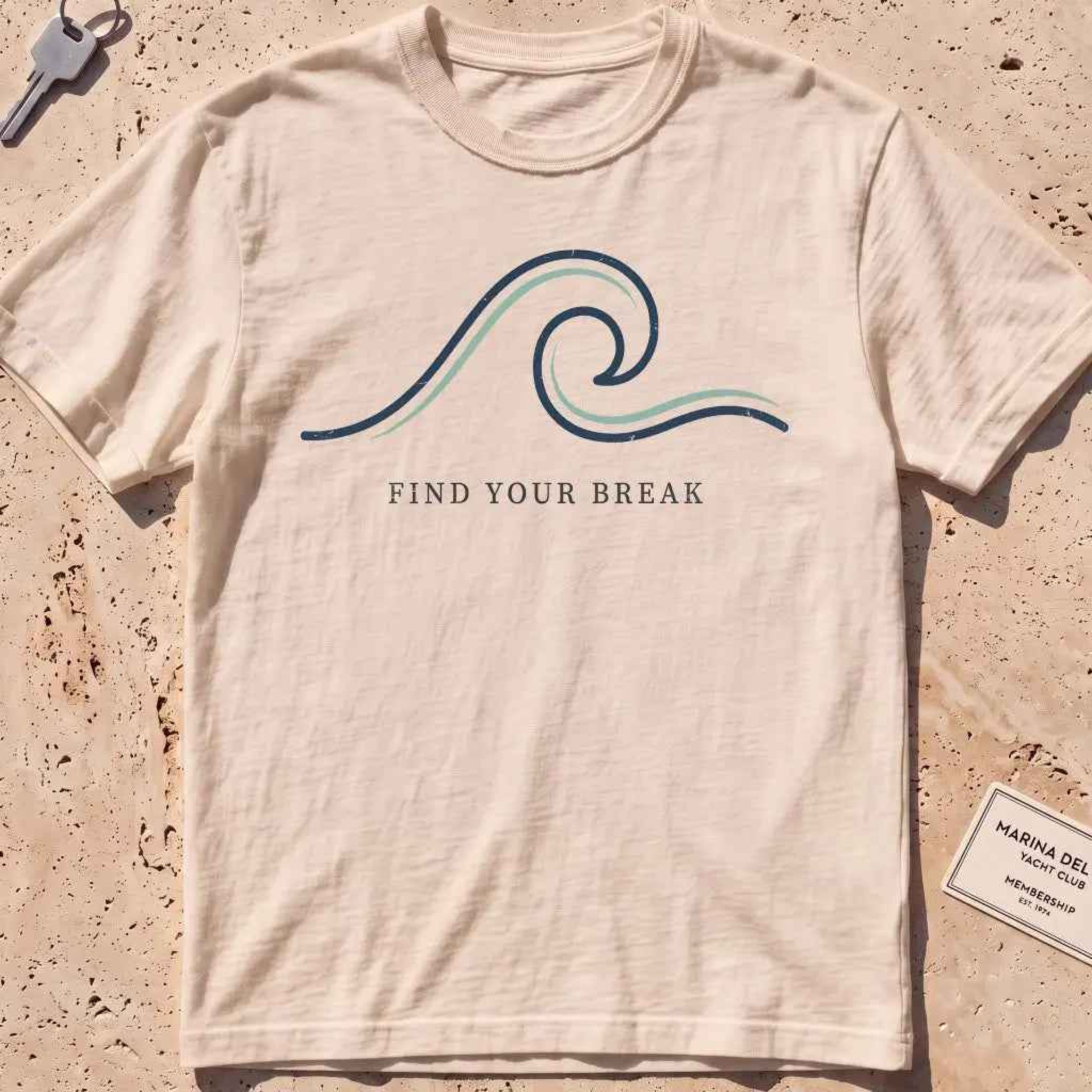 ivory heavyweight tee with a single-line wave "Find Your Break" graphic.
