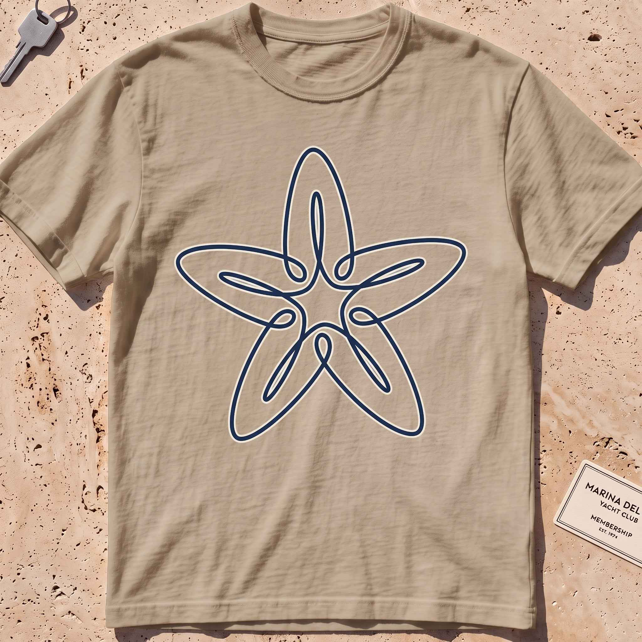 khaki heavyweight tee with a single-line five-armed starfish graphic.