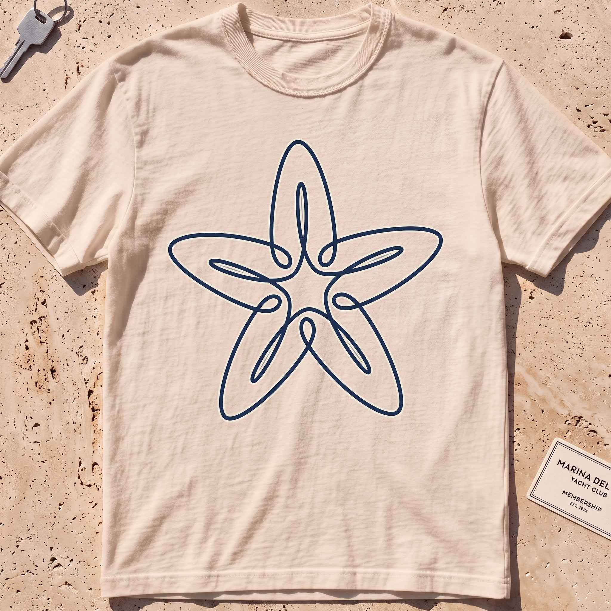 ivory heavyweight tee with a single-line five-armed starfish graphic.