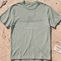 bay heavyweight tee with a single-line kayaker "Powered by Paddle" graphic.
