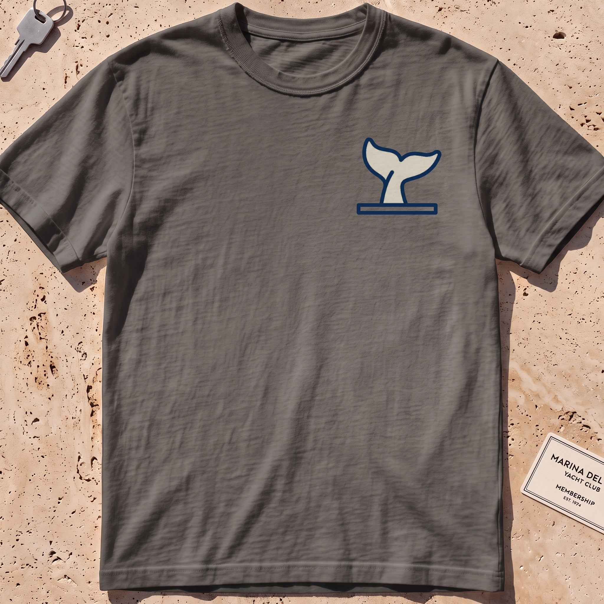 pepper heavyweight tee with a diving whale-fluke crest graphic.