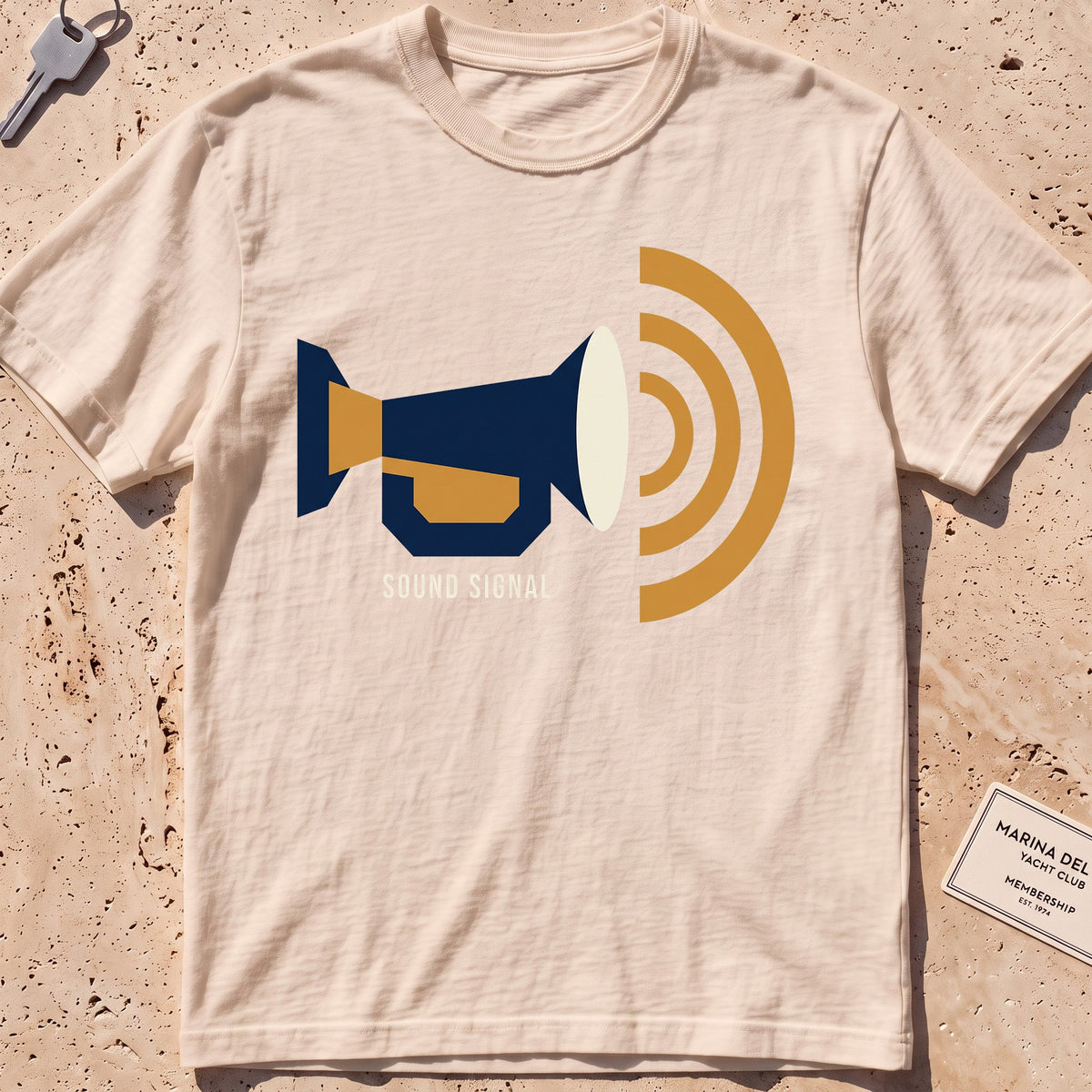 ivory heavyweight tee with a flat-geometric foghorn "Sound Signal" graphic.