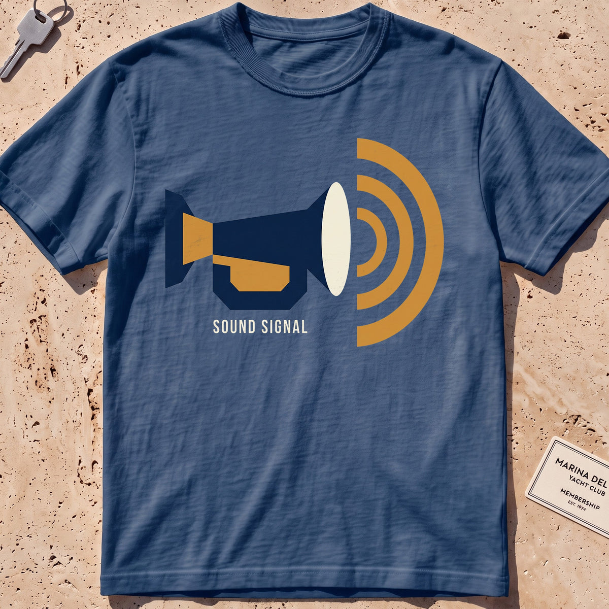 midnight heavyweight tee with a flat-geometric foghorn "Sound Signal" graphic.