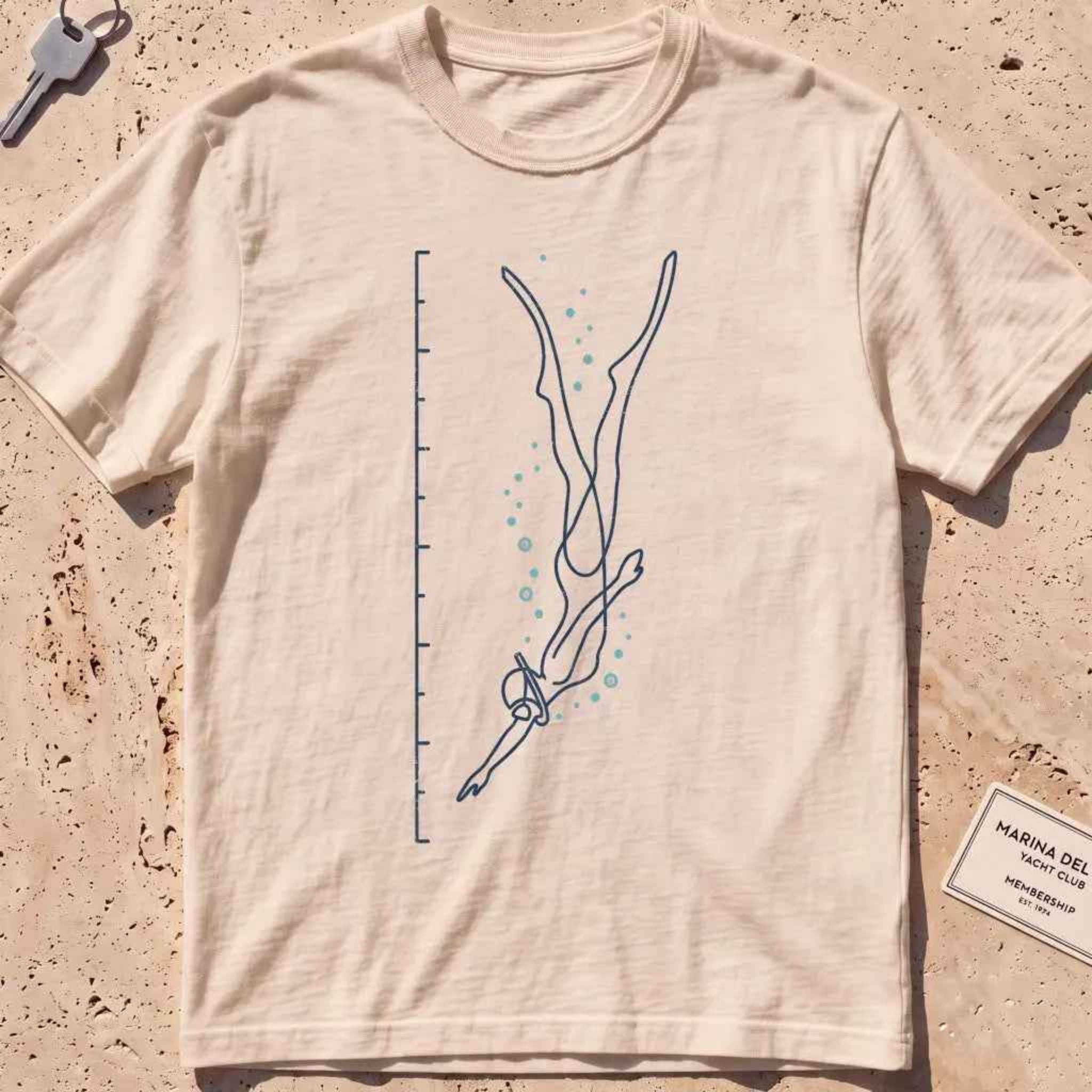 ivory heavyweight tee with a single-line freediver and depth-scale graphic.
