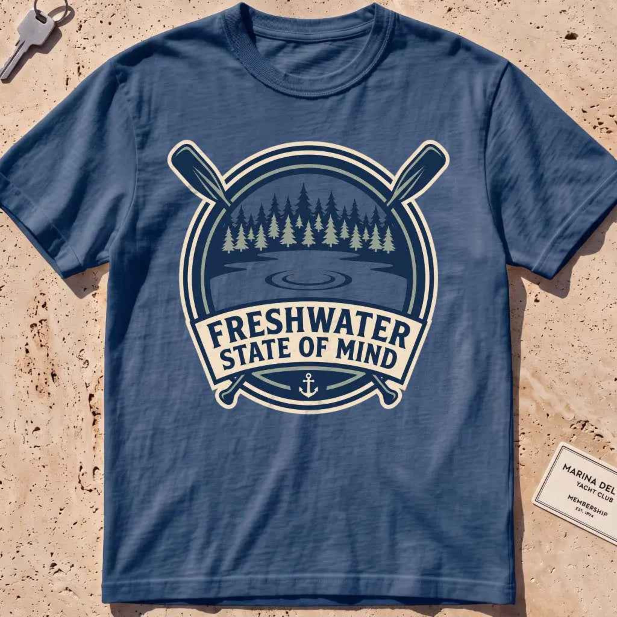 midnight heavyweight tee with a lake-and-pines "Freshwater State of Mind" crest.