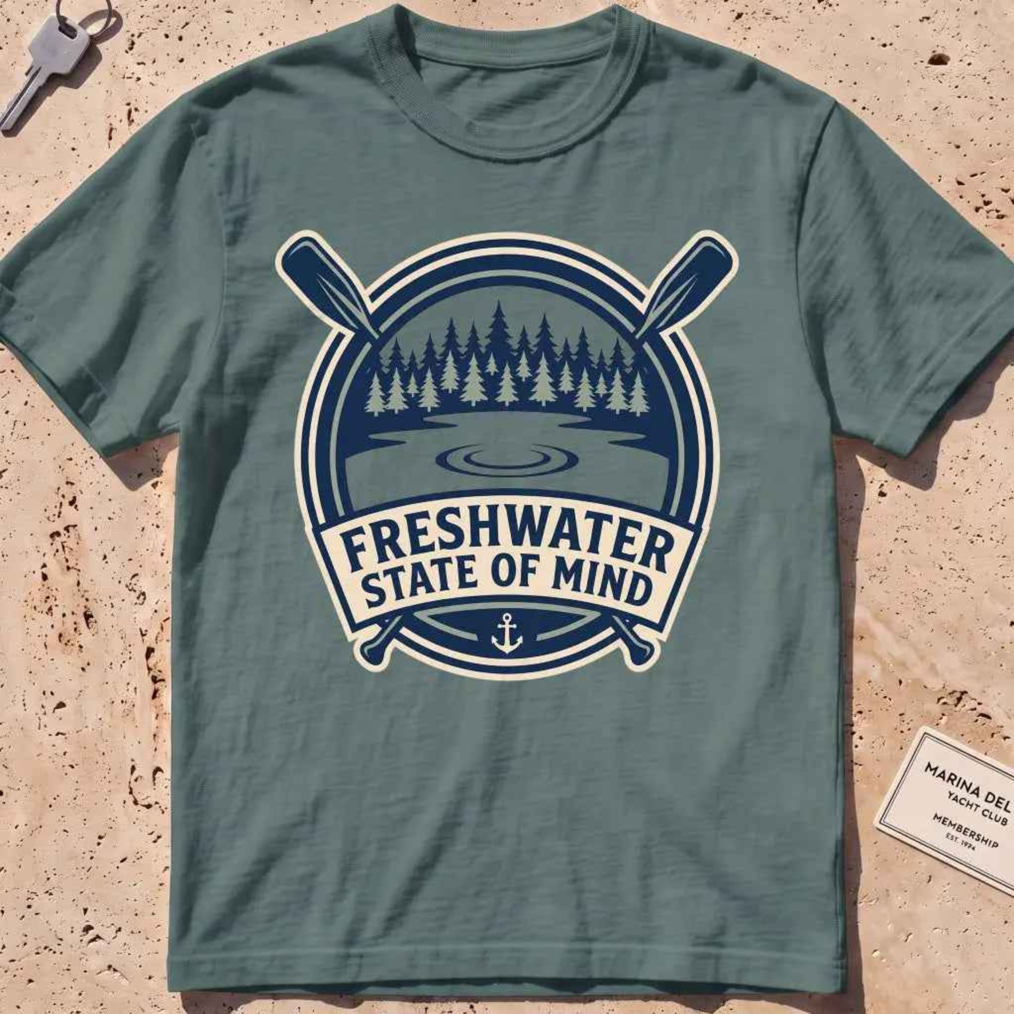 blue spruce heavyweight tee with a lake-and-pines "Freshwater State of Mind" crest.