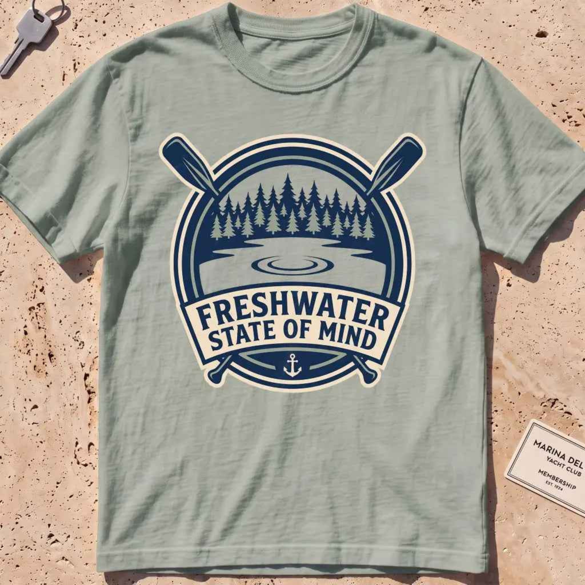bay heavyweight tee with a lake-and-pines "Freshwater State of Mind" crest.