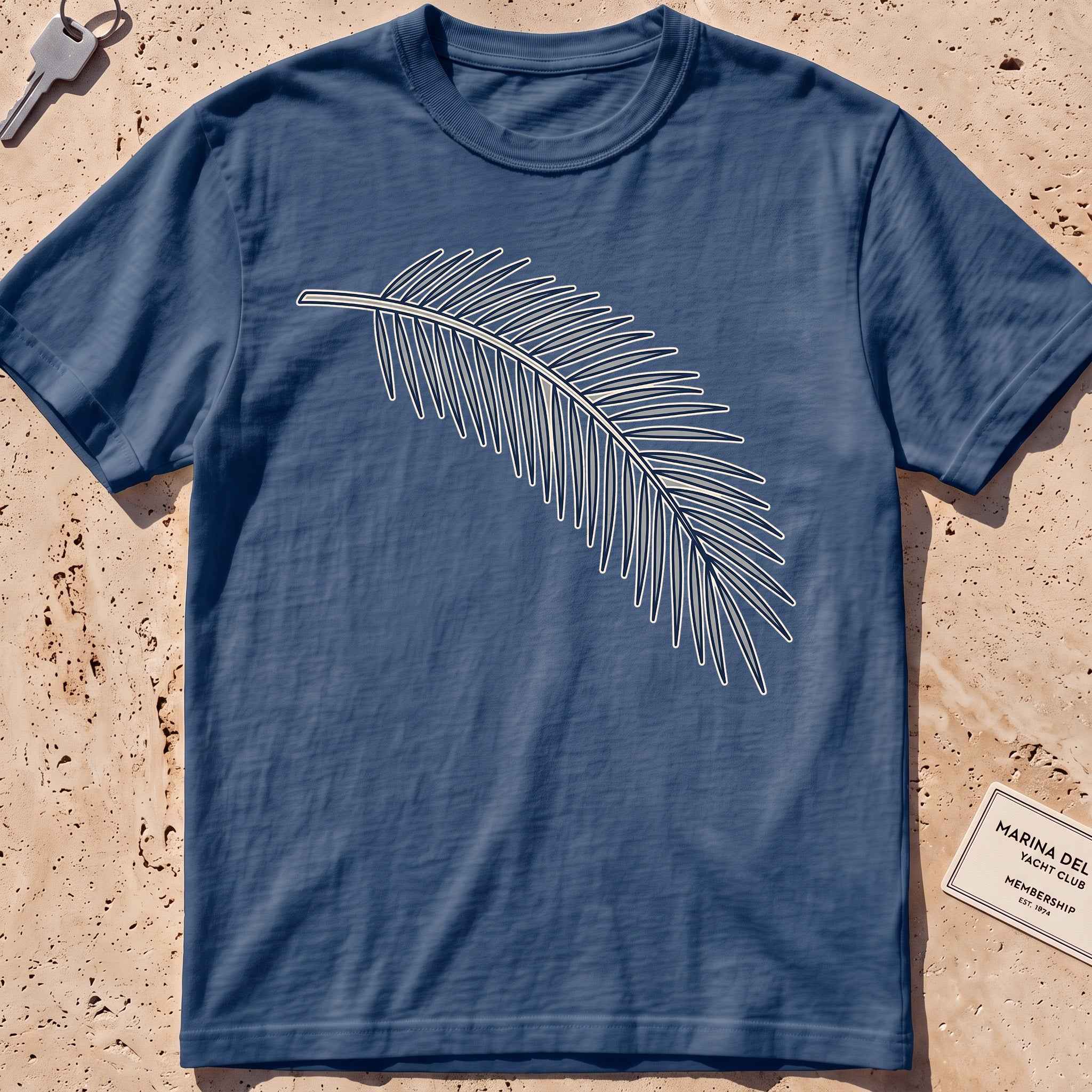 midnight heavyweight tee with a single-line palm frond graphic.