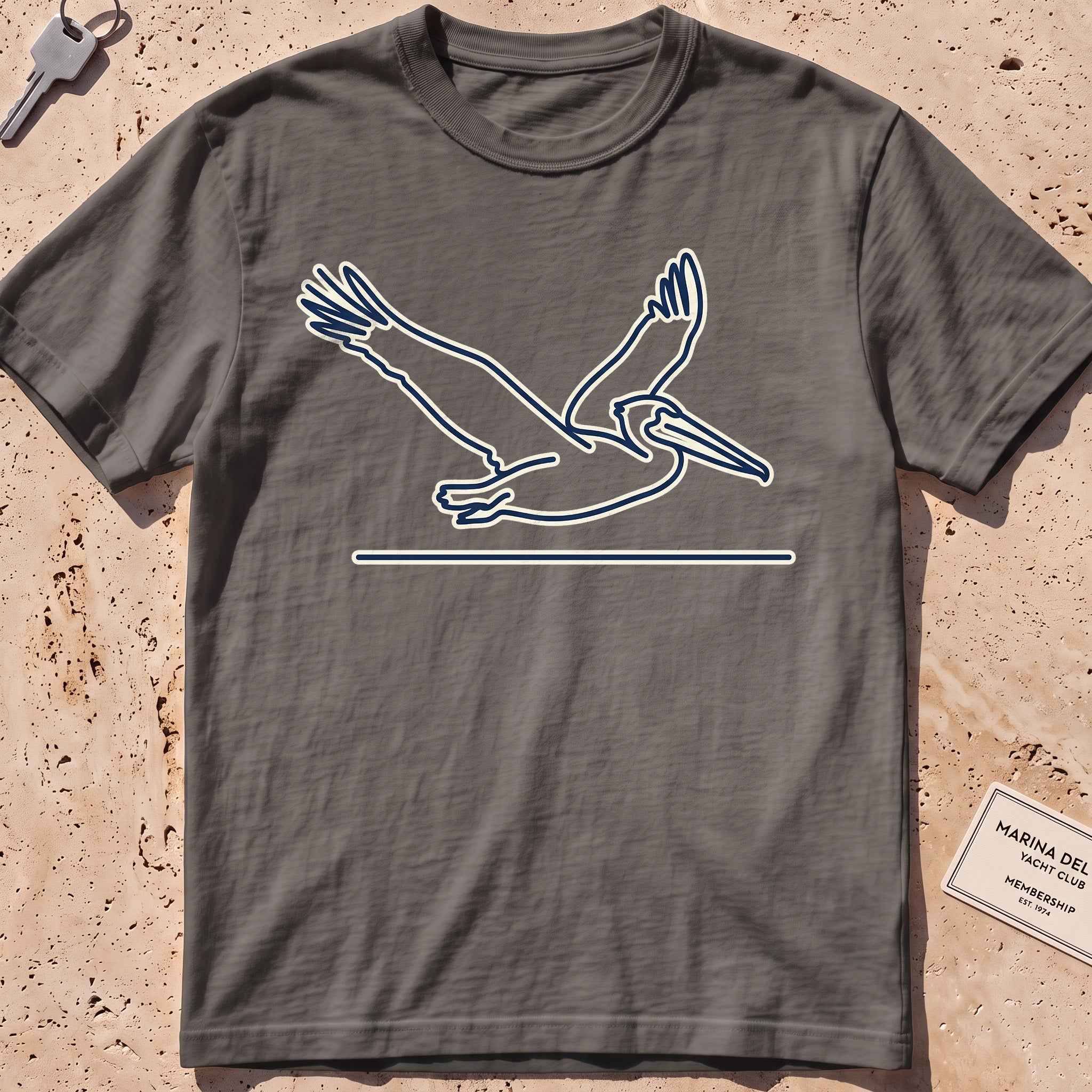pepper heavyweight tee with a single-line gliding pelican graphic.