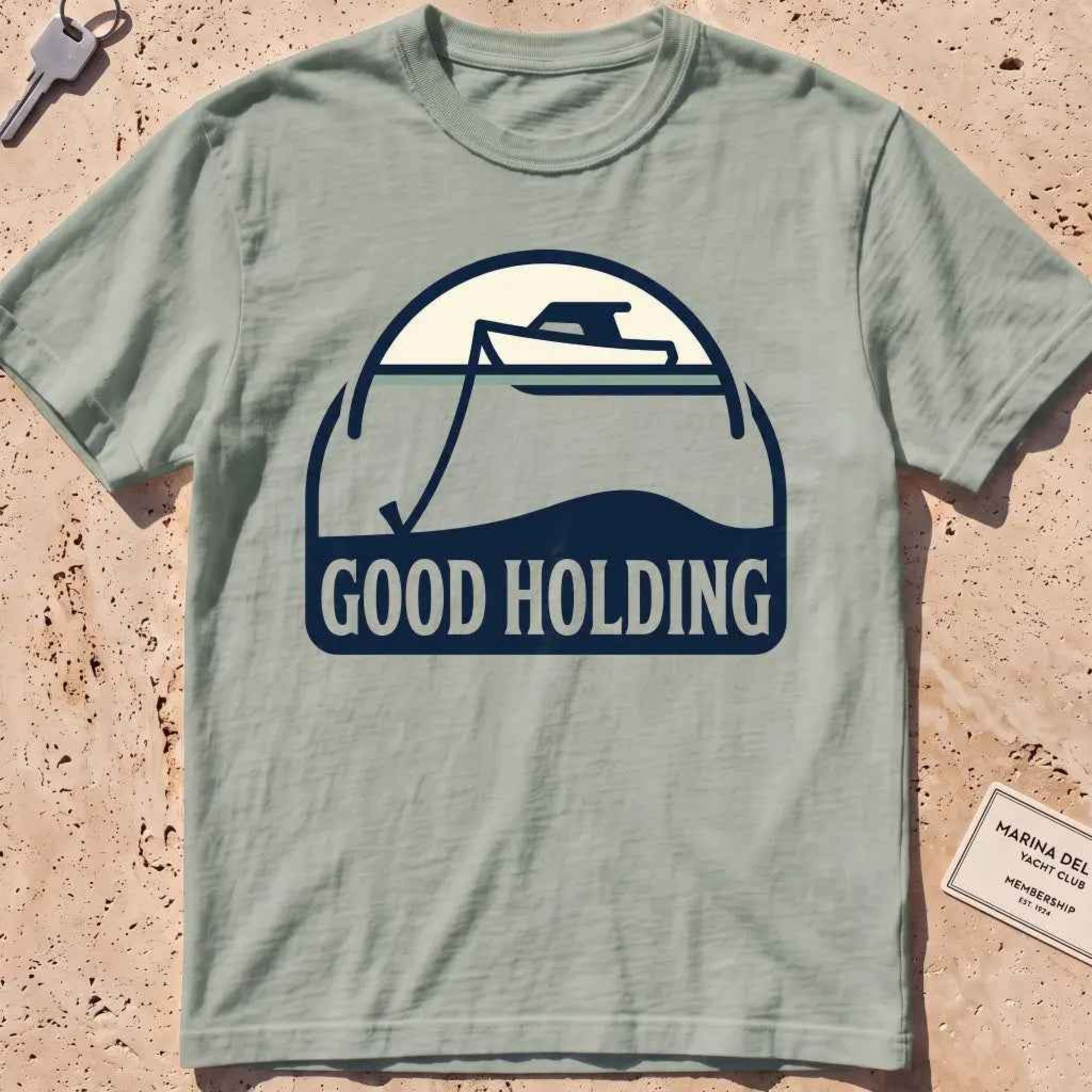bay heavyweight tee with a boat and anchor-rode "Good Holding" badge.