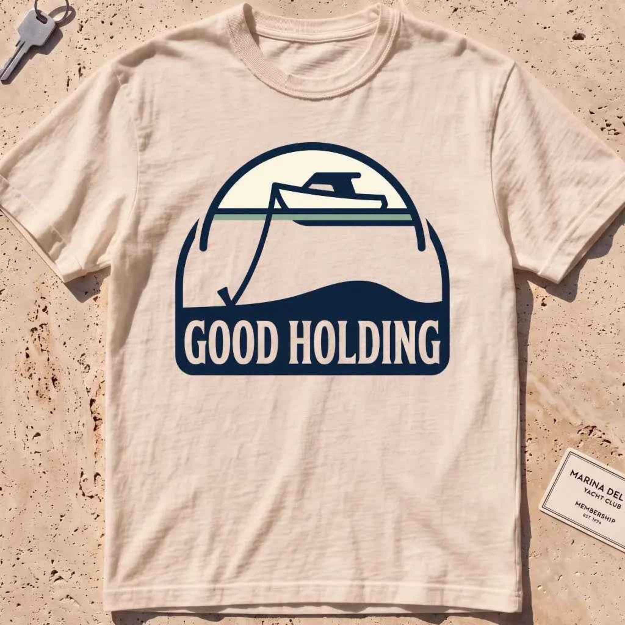 ivory heavyweight tee with a boat and anchor-rode "Good Holding" badge.