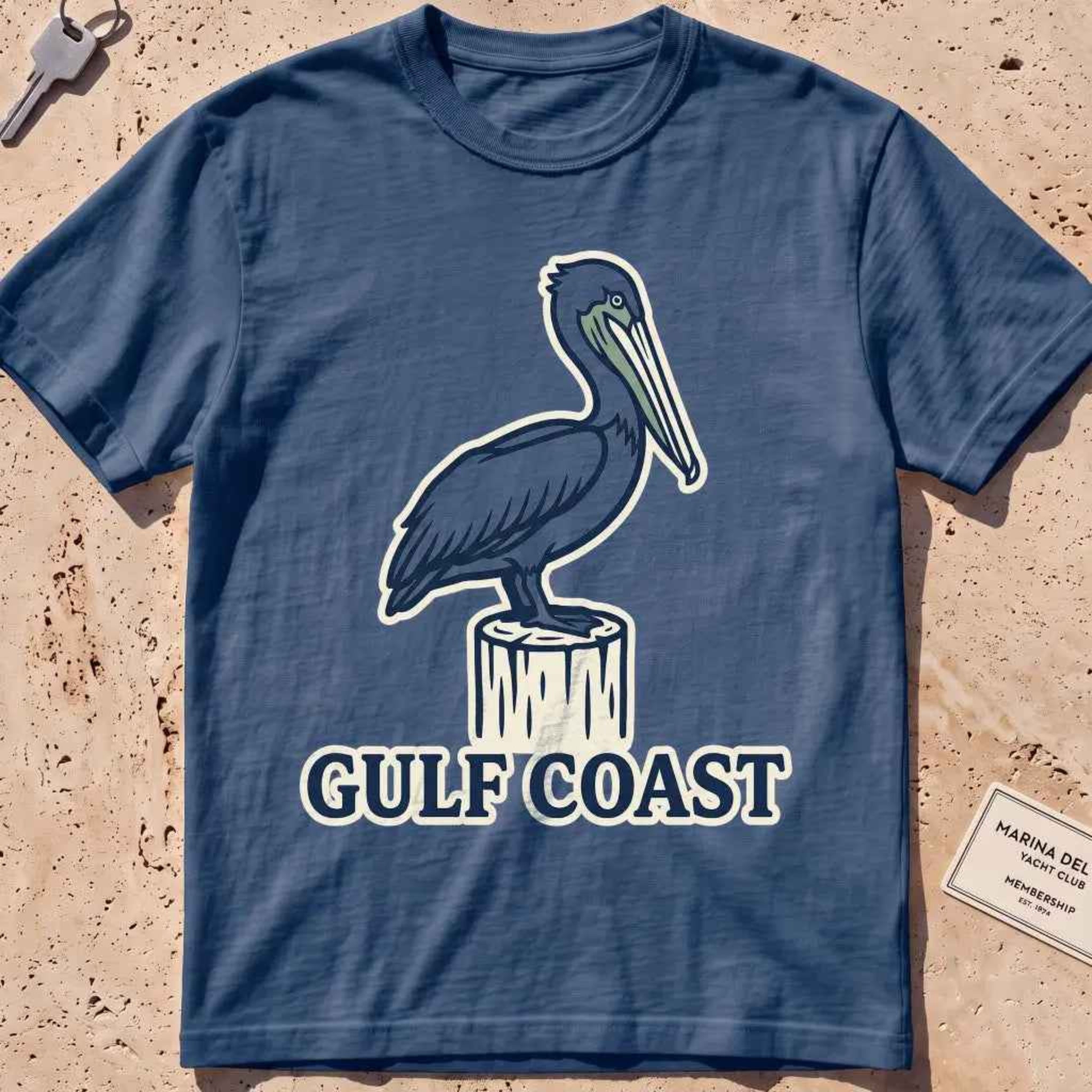 midnight heavyweight tee with a pelican perched on a dock piling graphic.