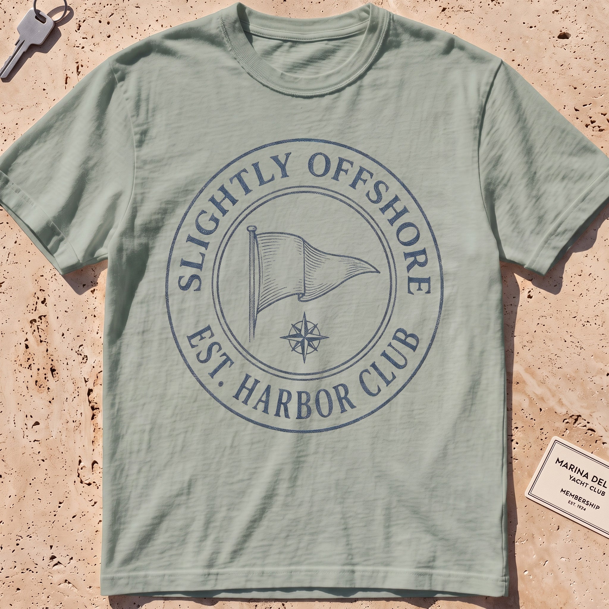 bay heavyweight tee with an engraved burgee and compass-seal crest.
