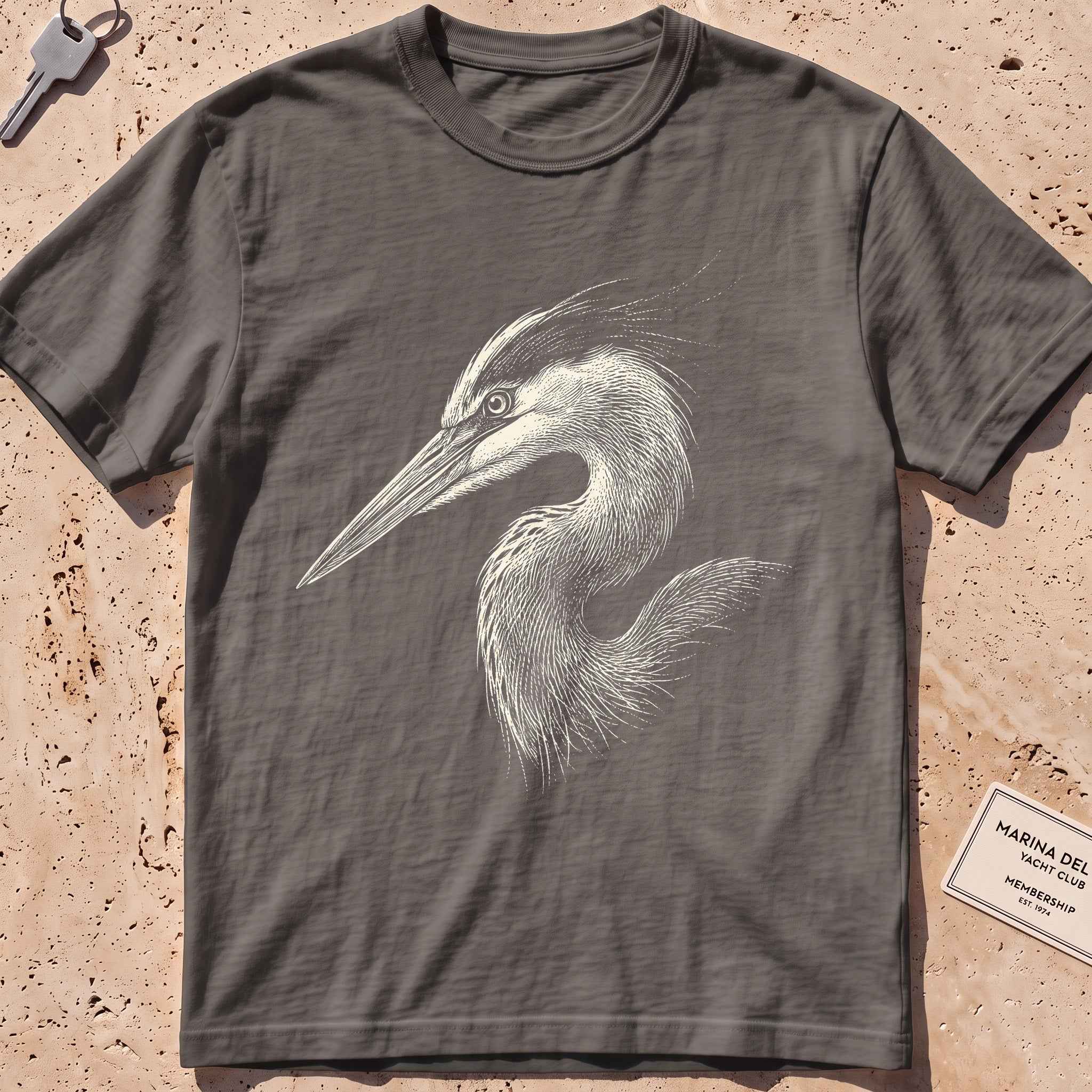 pepper heavyweight tee with an etched heron-head portrait graphic.