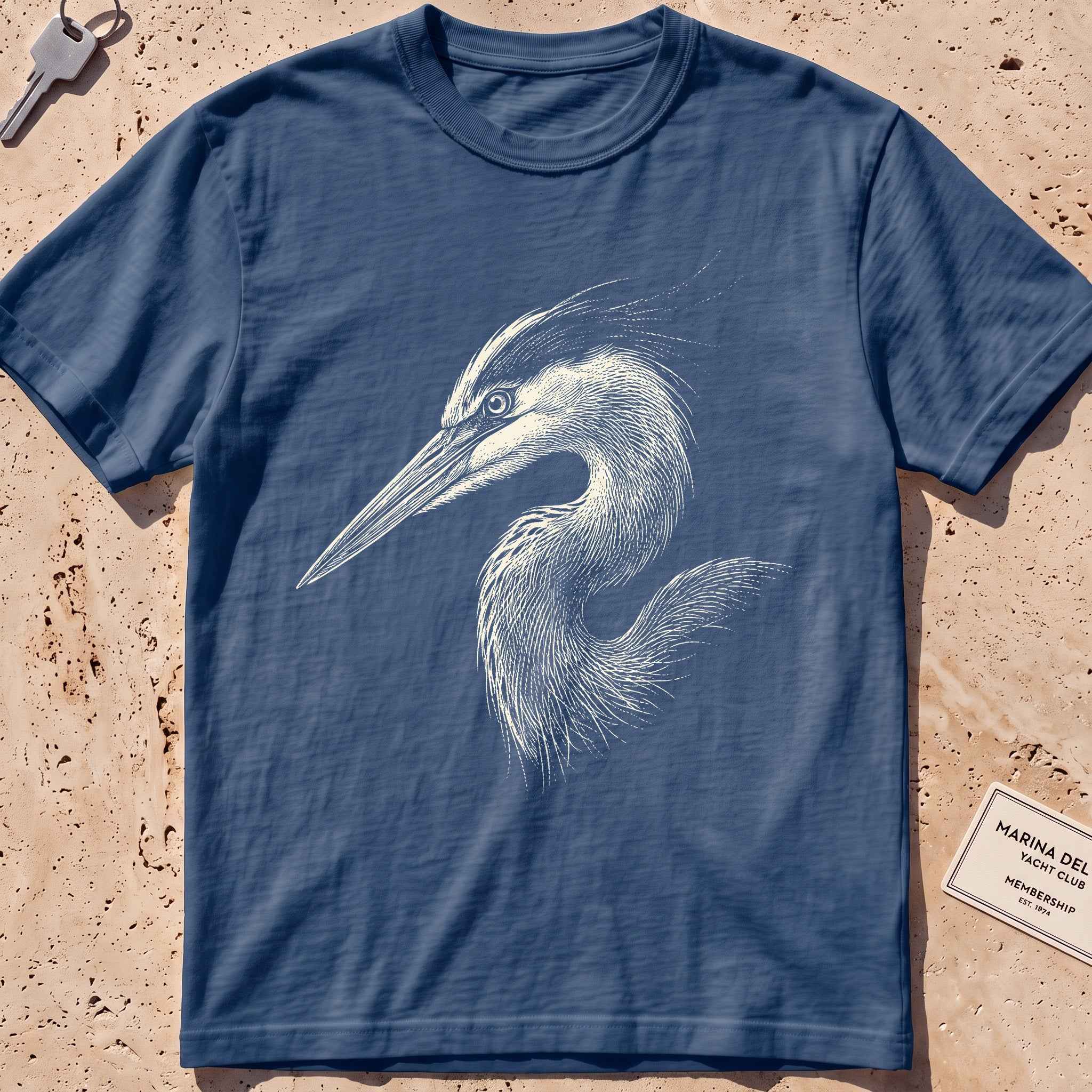midnight heavyweight tee with an etched heron-head portrait graphic.