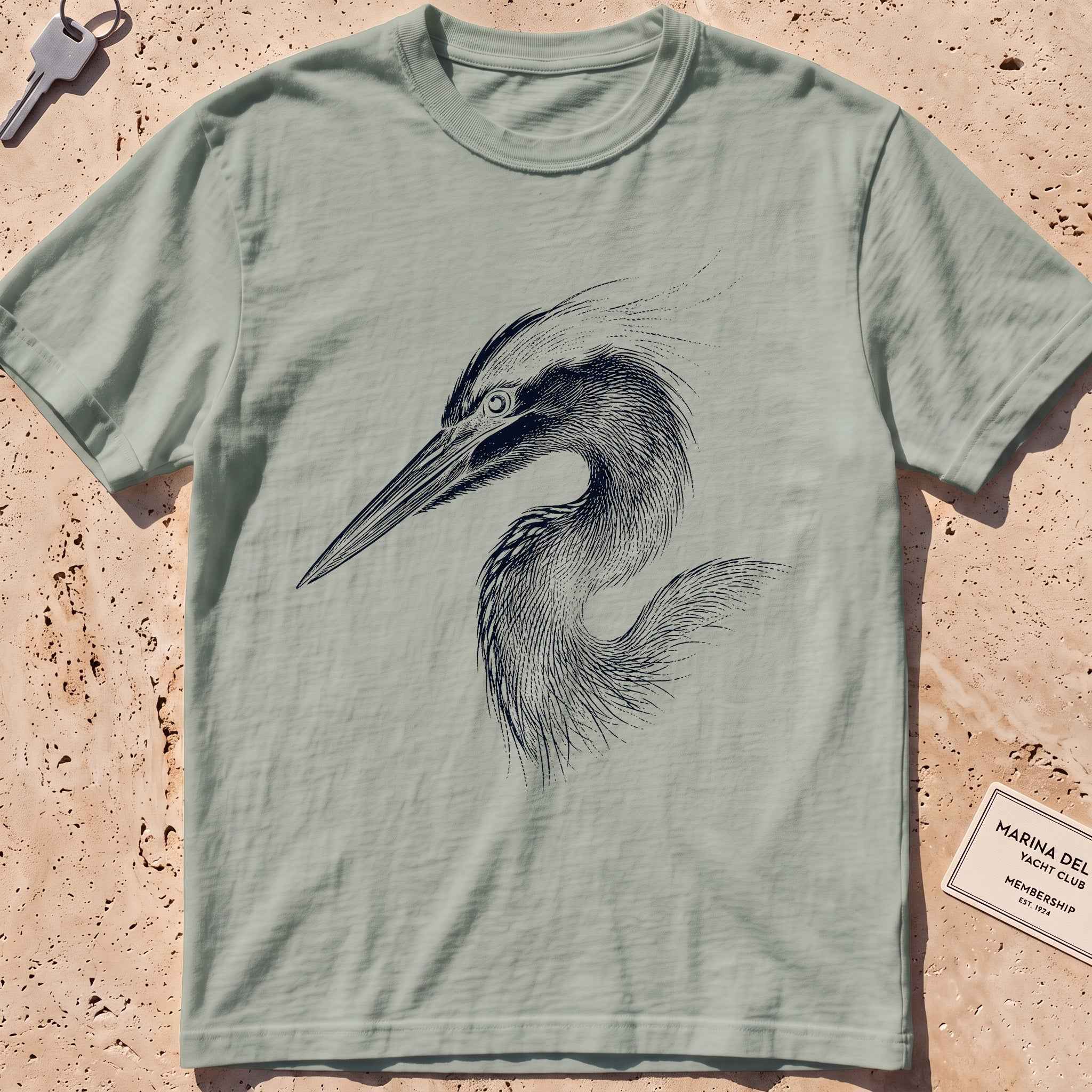 bay heavyweight tee with an etched heron-head portrait graphic.