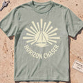 bay heavyweight tee with a sunburst sailboat "Horizon Chaser" badge.
