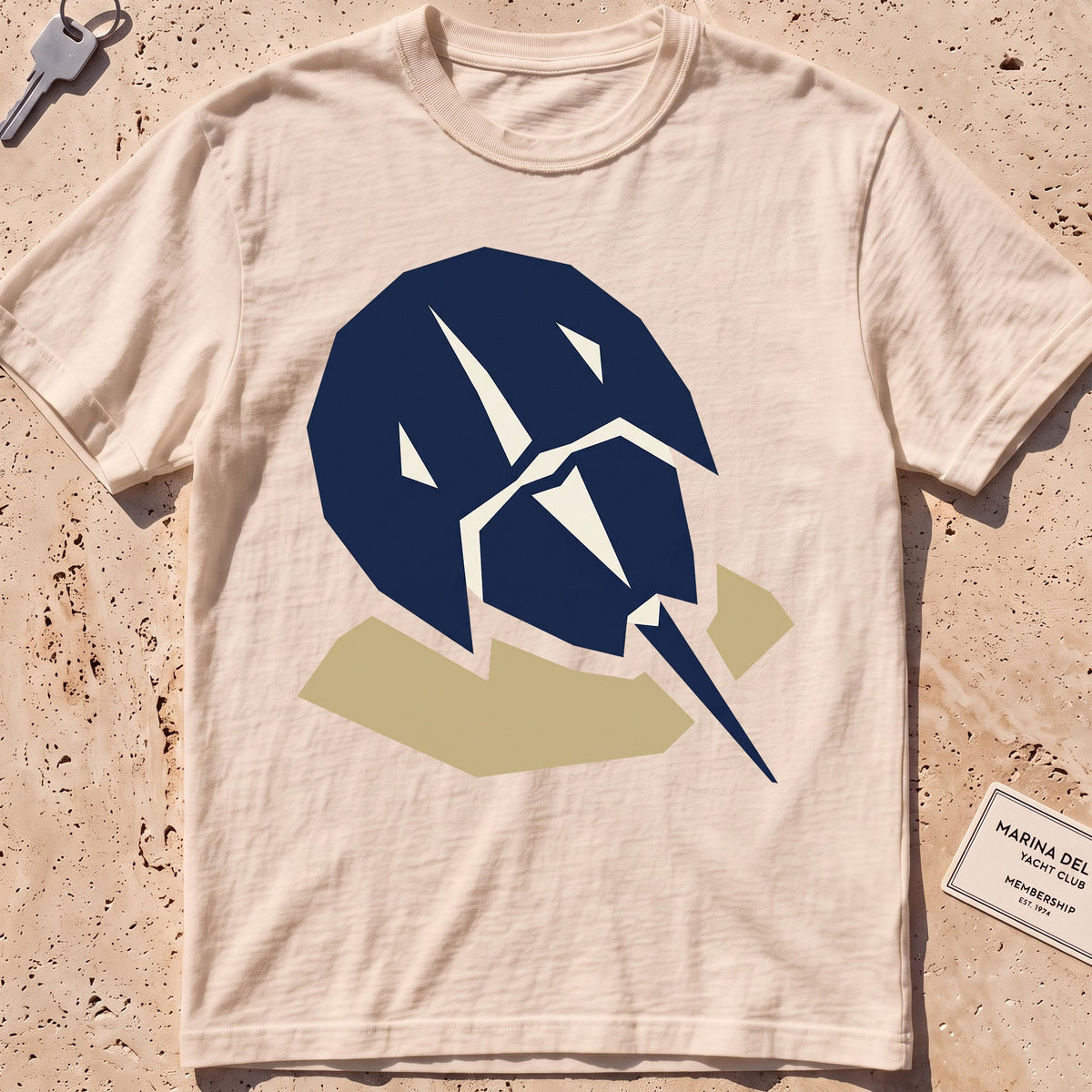 ivory heavyweight tee with a flat-geometric horseshoe crab graphic.