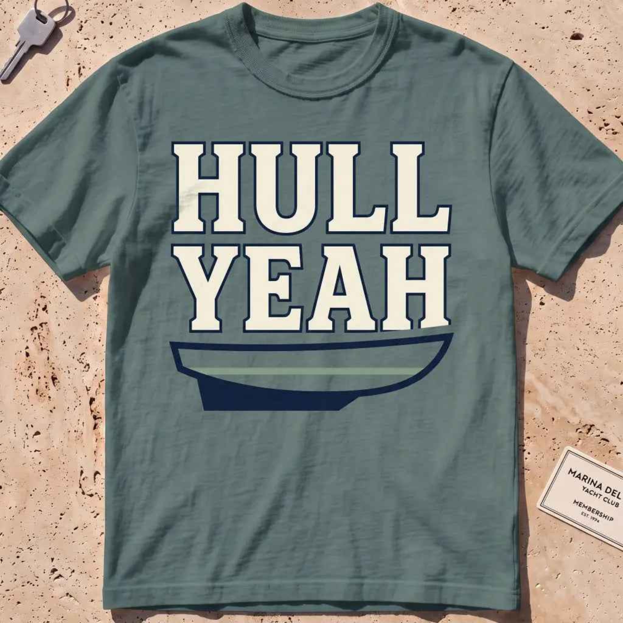 blue spruce heavyweight tee with a boat hull and bold "Hull Yeah" nautical pun type.