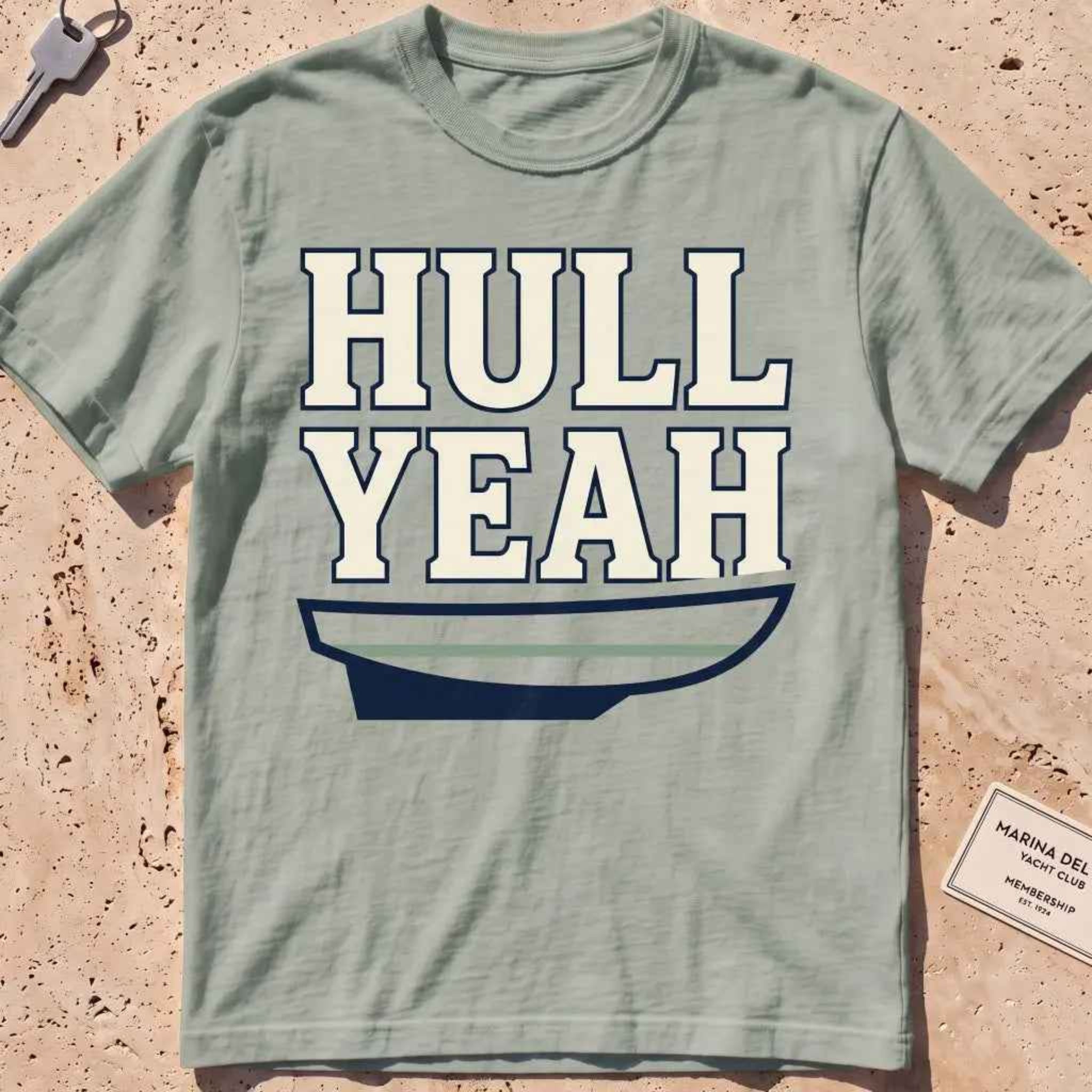 bay heavyweight tee with a boat hull and bold "Hull Yeah" nautical pun type.