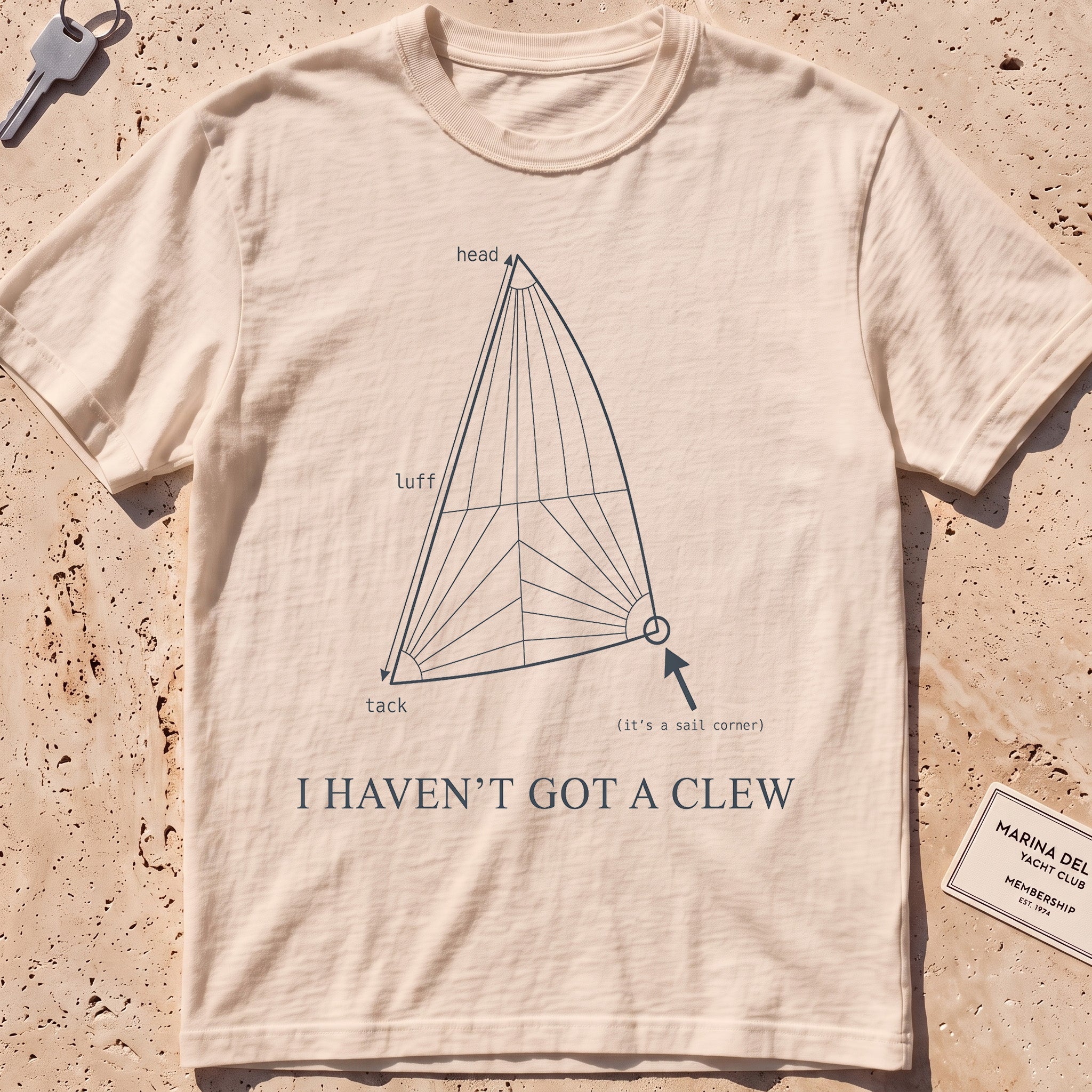 ivory heavyweight tee with a labelled sail diagram "I Haven't Got a Clew" graphic.