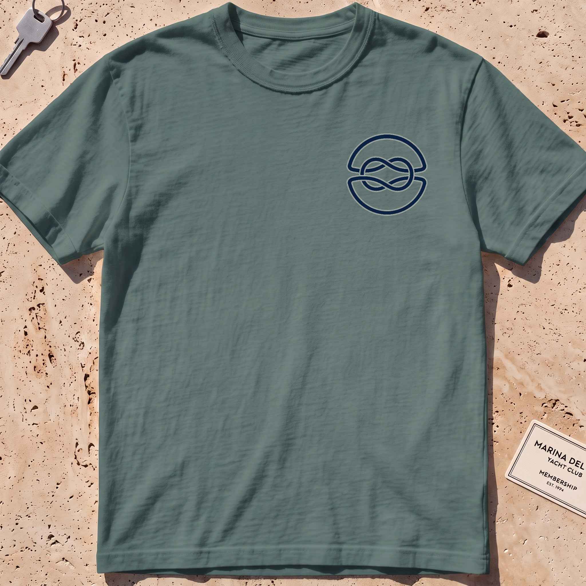 blue spruce heavyweight tee with a clean overhand-knot crest graphic.