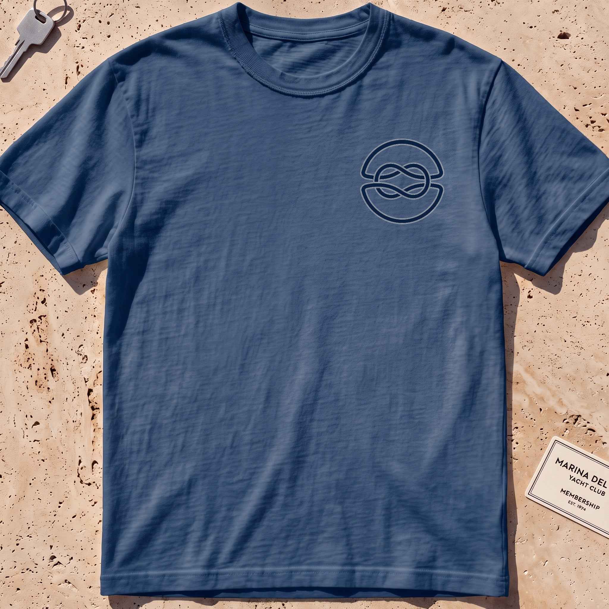 midnight heavyweight tee with a clean overhand-knot crest graphic.