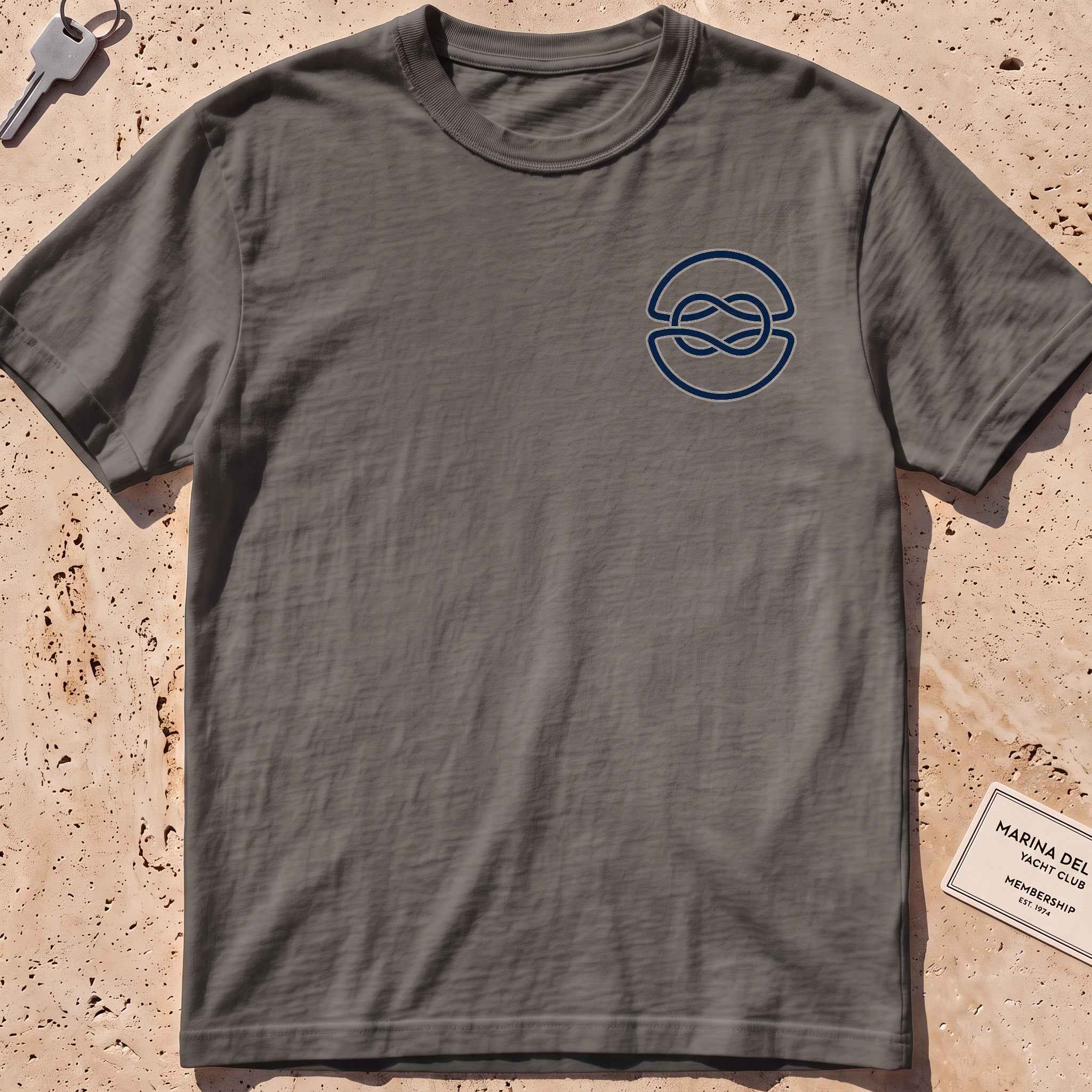 pepper heavyweight tee with a clean overhand-knot crest graphic.
