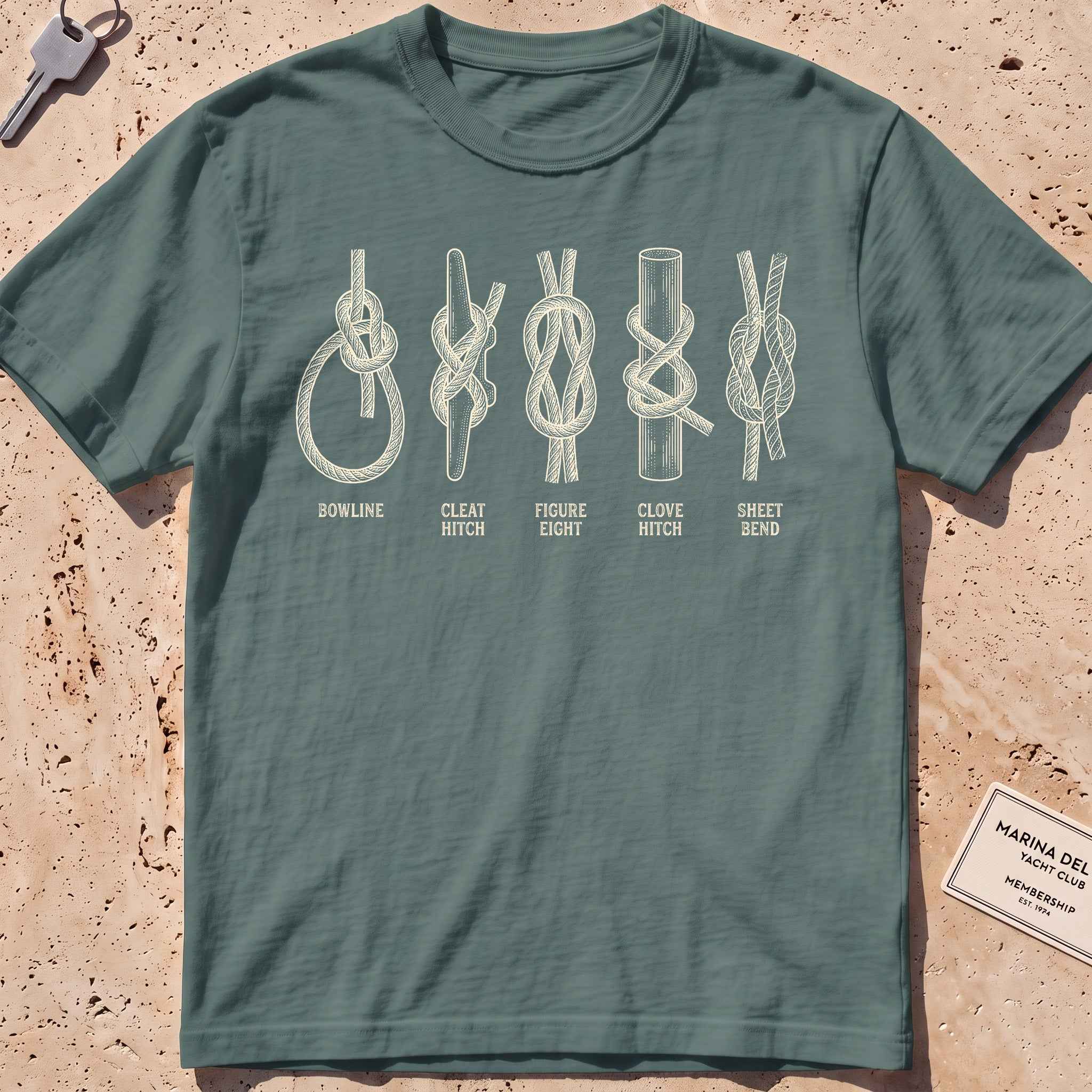 blue spruce heavyweight tee with an etched chart of sailing knots graphic.
