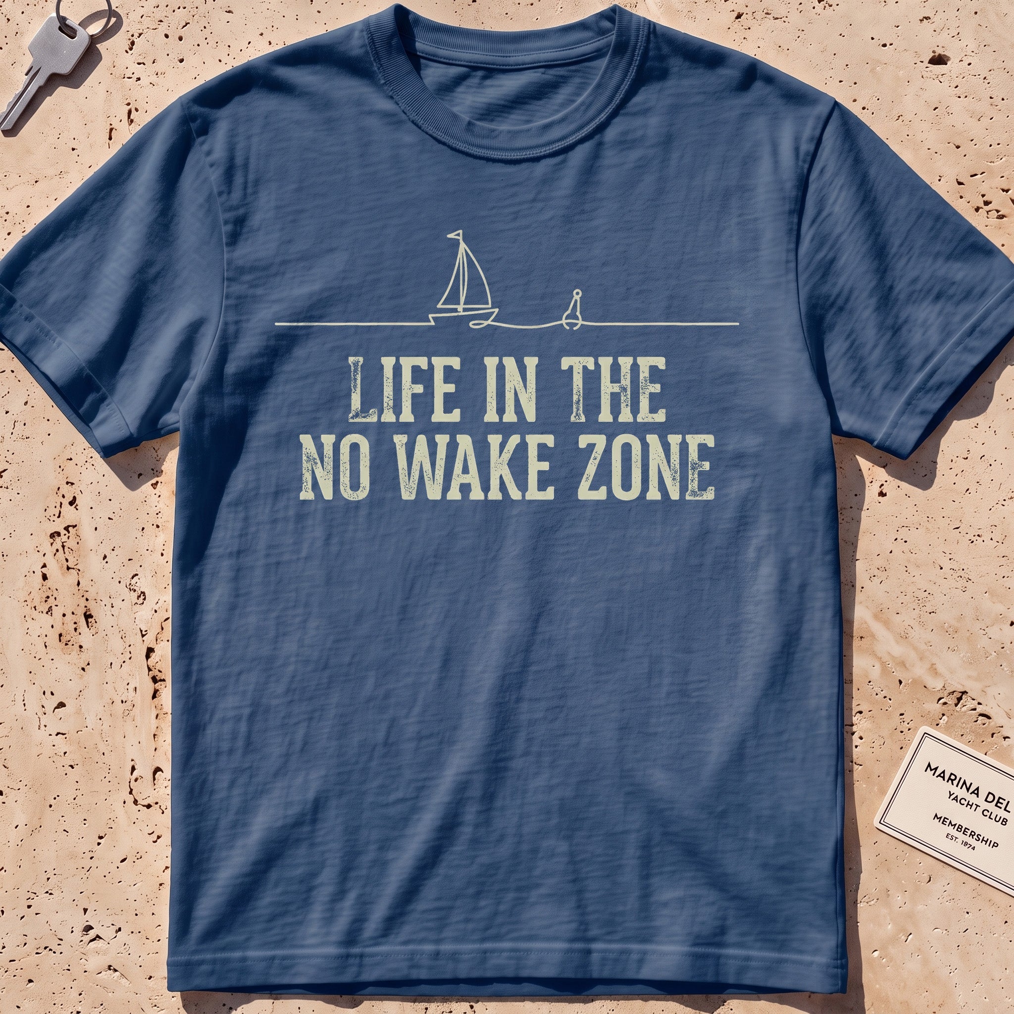 midnight heavyweight tee with a single-line sailboat, buoy and "No Wake Zone" text.