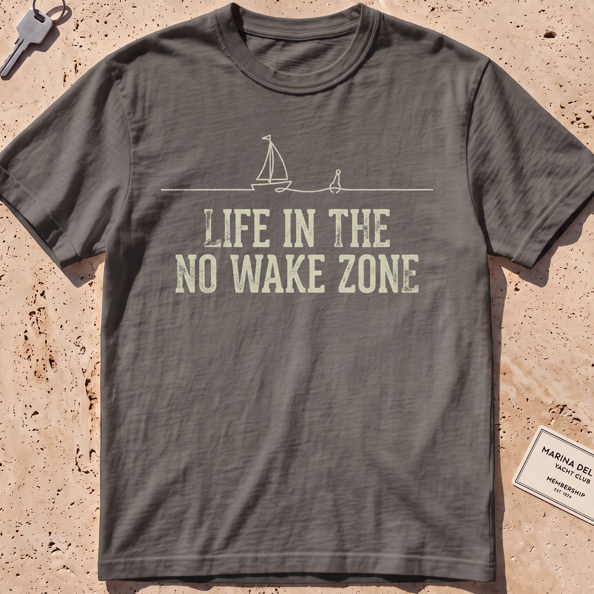 pepper heavyweight tee with a single-line sailboat, buoy and "No Wake Zone" text.