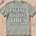 bay heavyweight tee with "Living by the Tides" type over a swell rule.