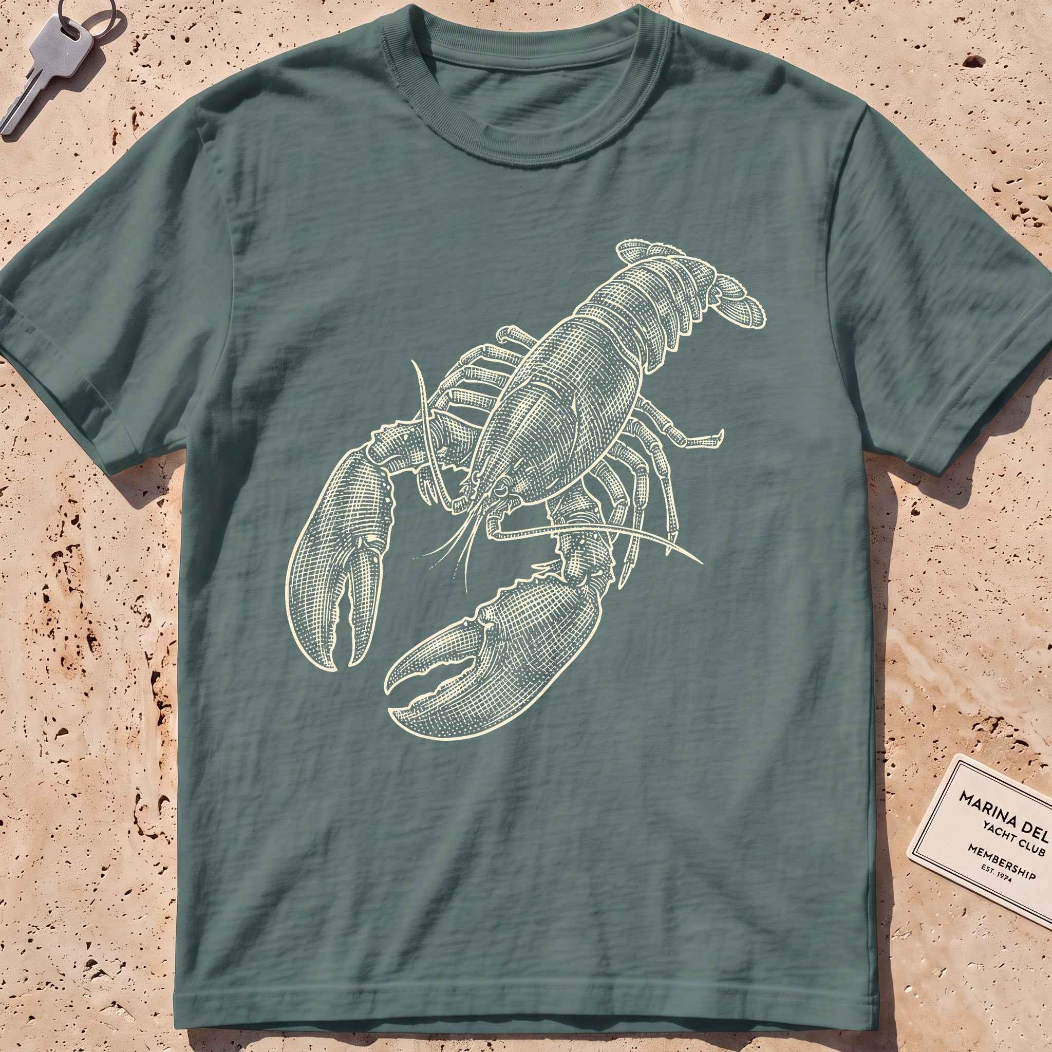 blue spruce heavyweight tee with a finely etched whole lobster graphic.