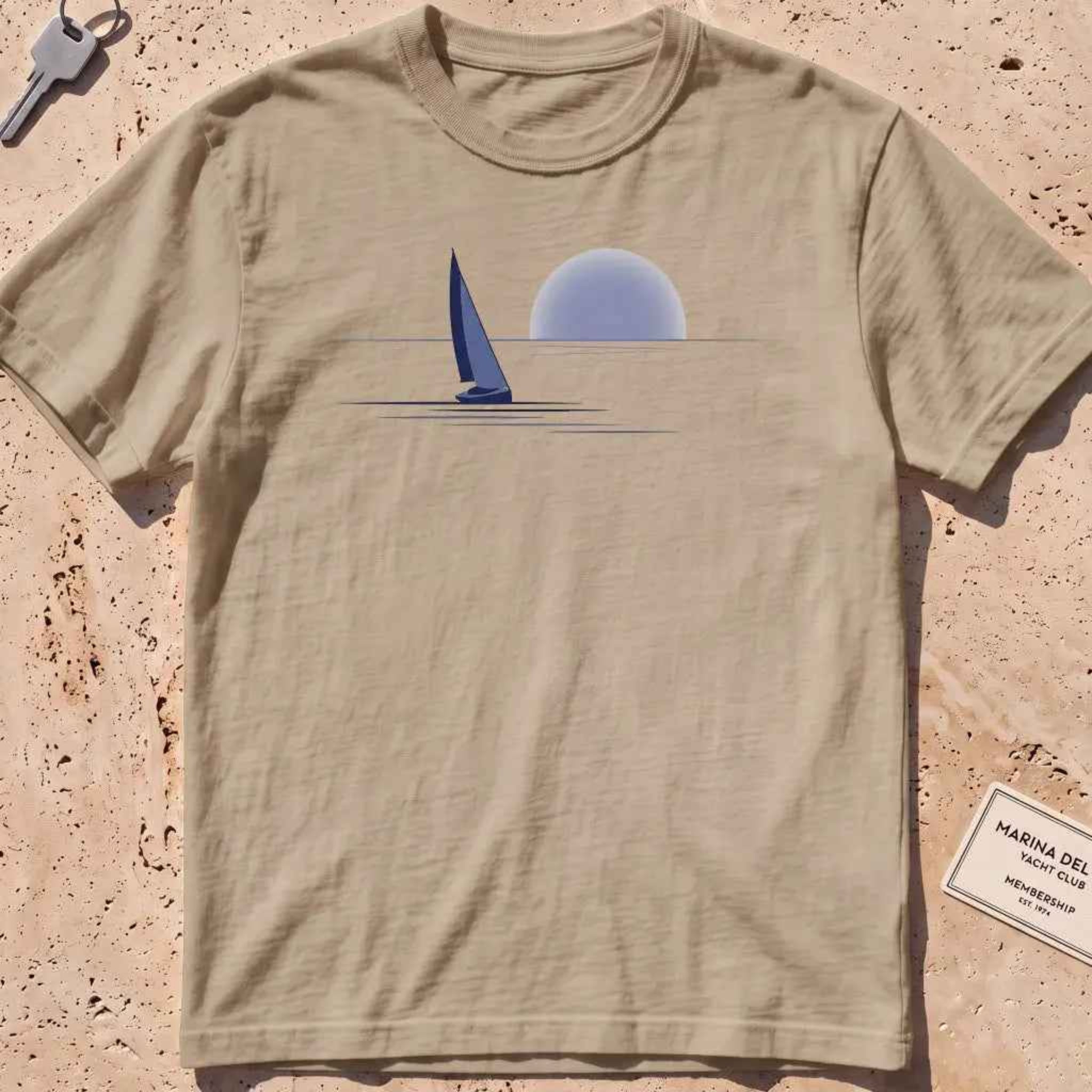 khaki heavyweight tee with a lone sail against a rising sun in minimal style.