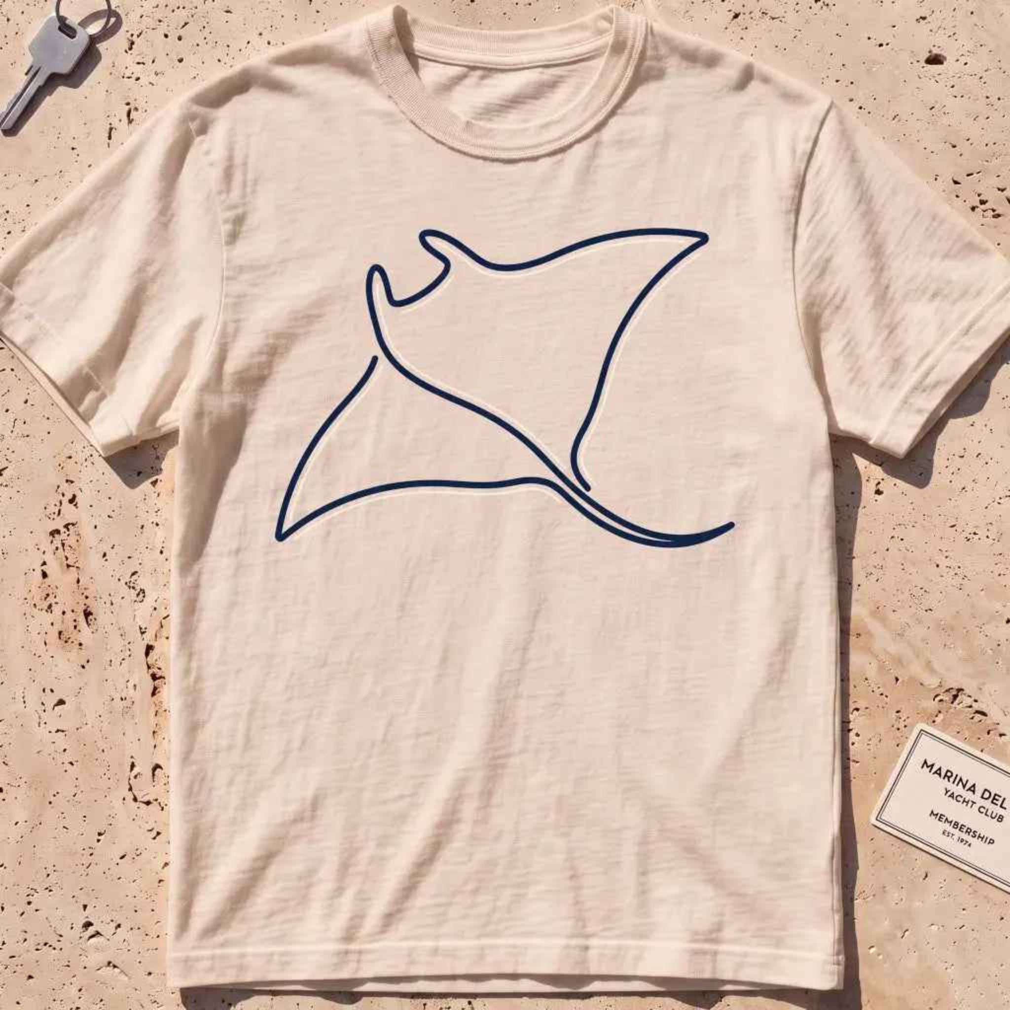 ivory heavyweight tee with a single continuous-line manta ray graphic.