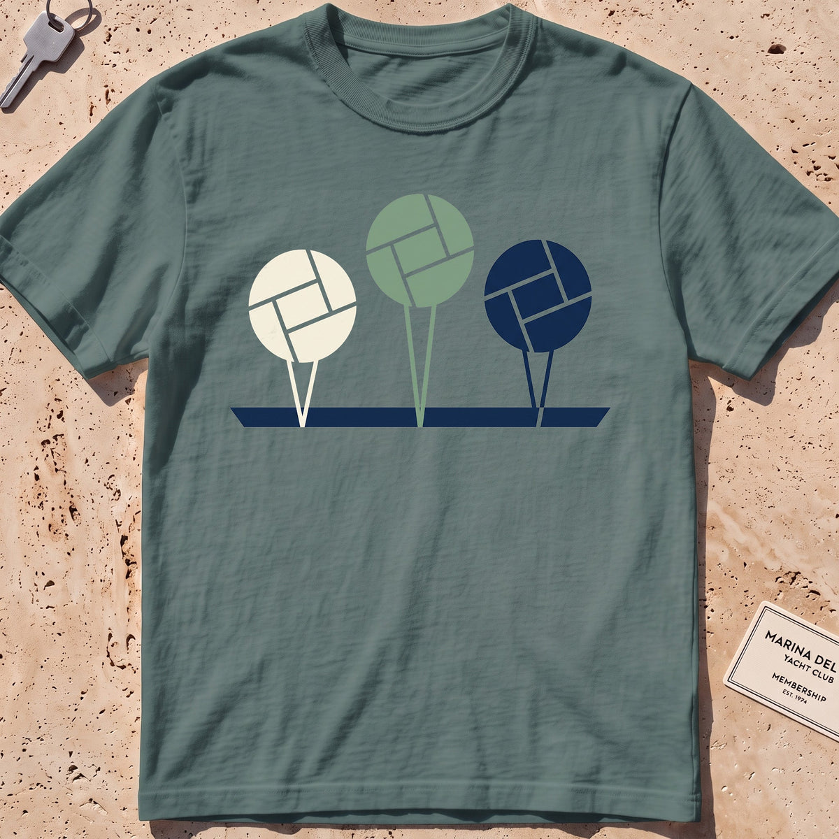 blue spruce heavyweight tee with flat-geometric mooring balls graphic.