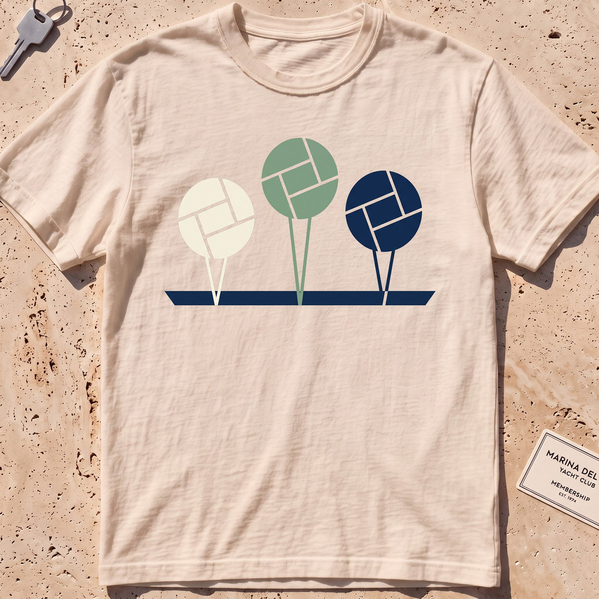 ivory heavyweight tee with flat-geometric mooring balls graphic.