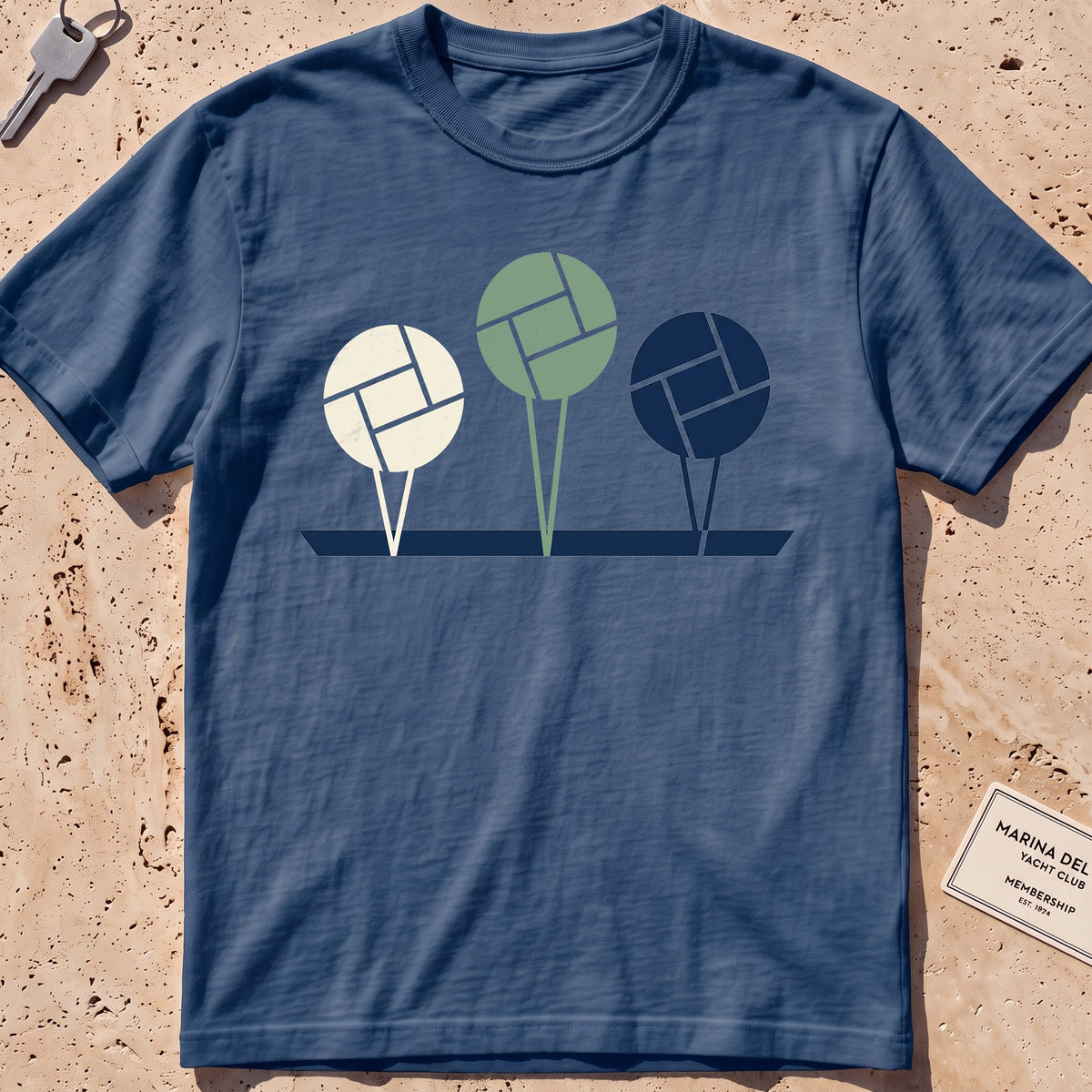 midnight heavyweight tee with flat-geometric mooring balls graphic.