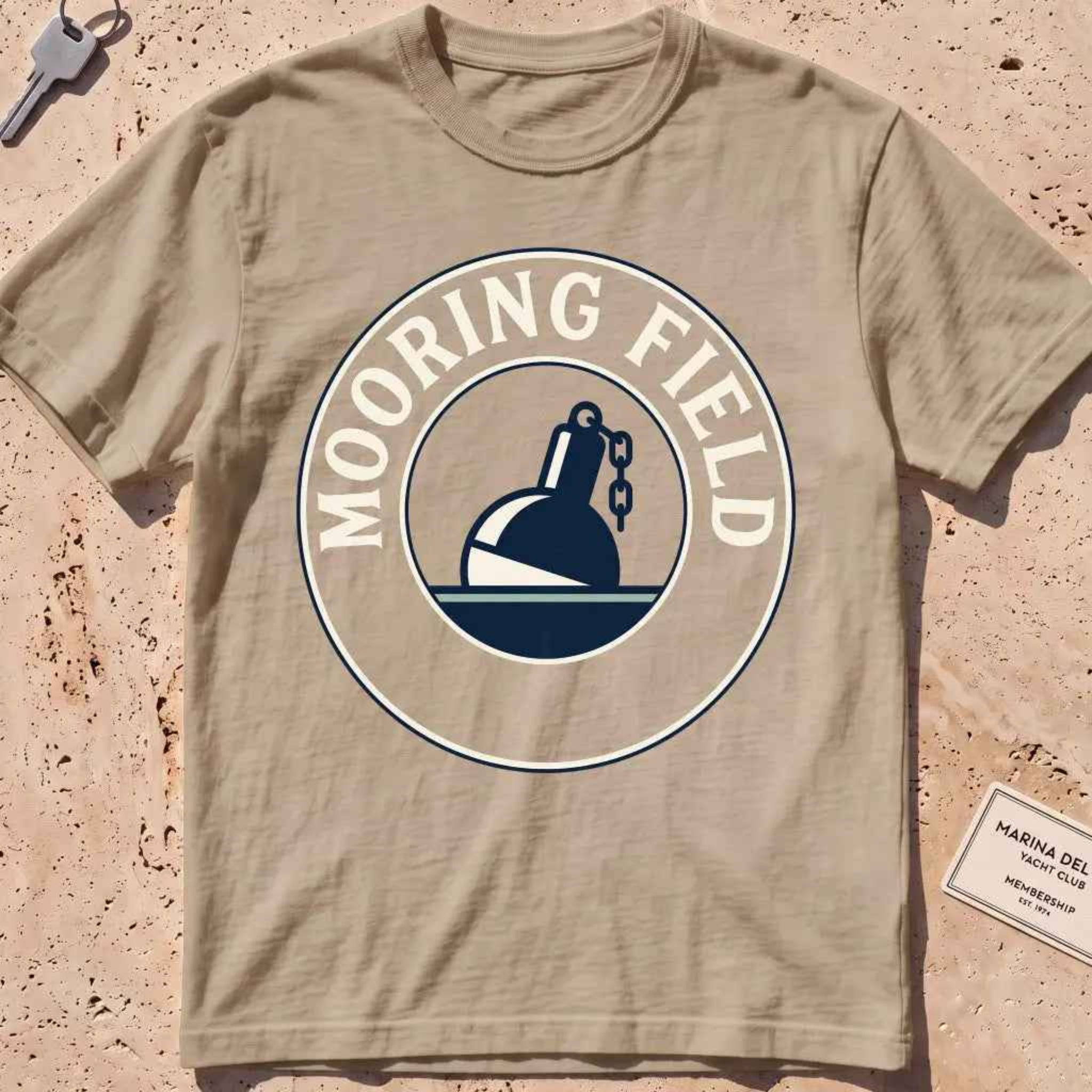 khaki heavyweight tee with a mooring buoy and chain harbor mooring-field badge graphic.