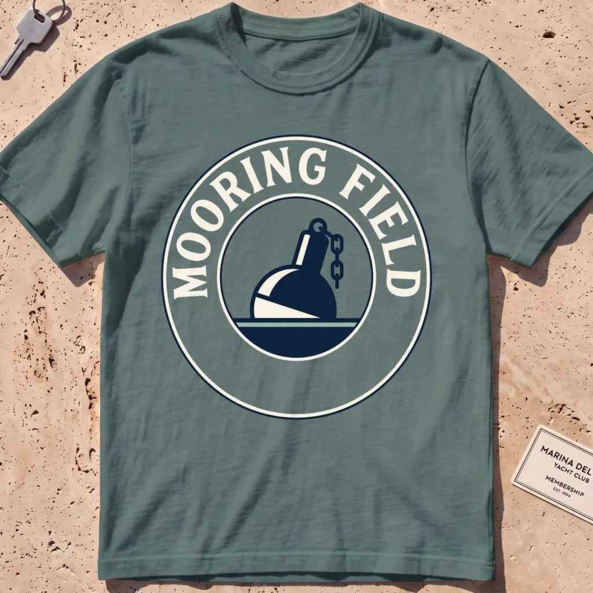 blue spruce heavyweight tee with a mooring buoy and chain harbor mooring-field badge graphic.